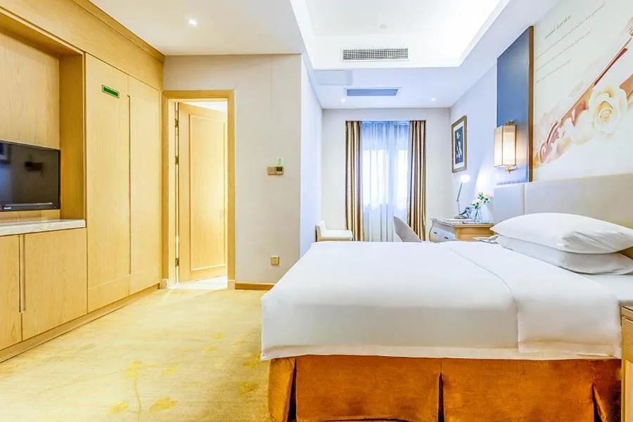 Bed in Vienna International Hotel Guangdong Zhengjiang Renming Avenue Middle Road