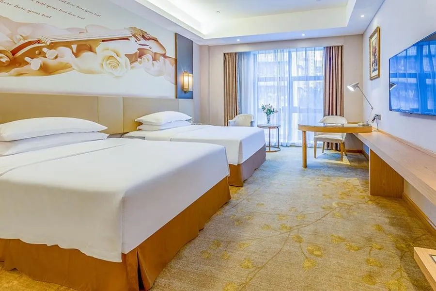 Bed in Vienna International Hotel Guangdong Zhengjiang Renming Avenue Middle Road