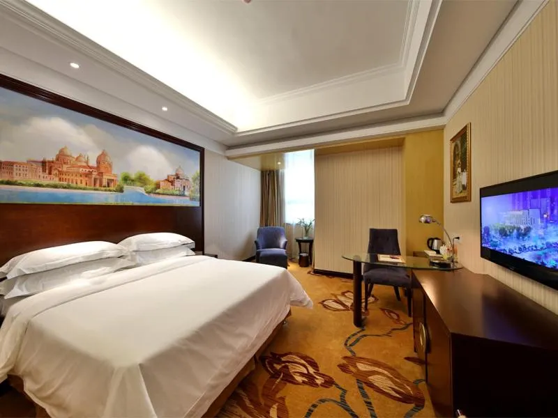 Bed in Vienna International Hotel Zhangjiajie Tianmen Mountain