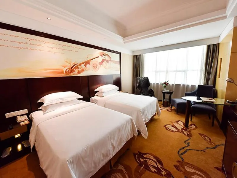 Bed in Vienna International Hotel Zhangjiajie Tianmen Mountain