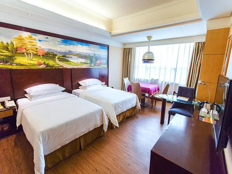 Bed in Vienna International Hotel Zhangjiajie Tianmen Mountain