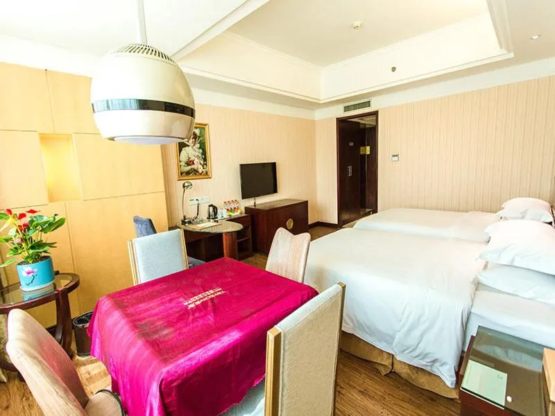 Bed in Vienna International Hotel Zhangjiajie Tianmen Mountain