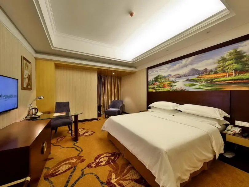 Bed in Vienna International Hotel Zhangjiajie Tianmen Mountain