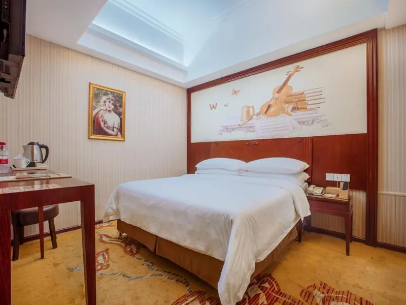 Bed in Vienna International Hotel Jieyang Jieyanglou
