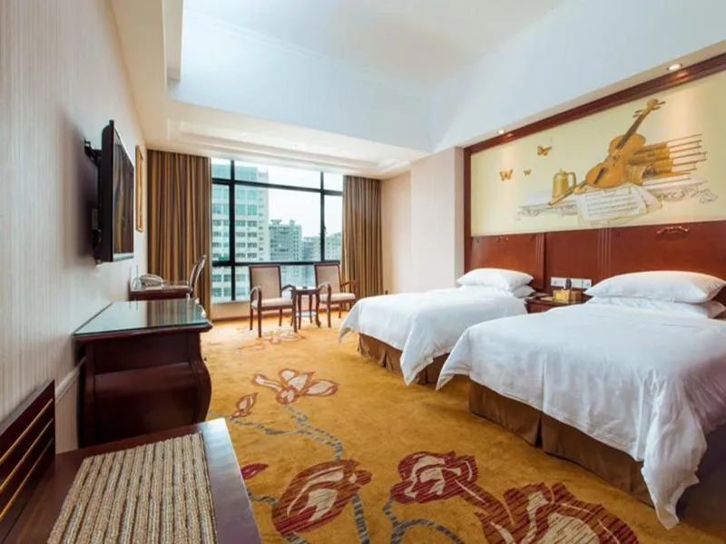 Bed in Vienna International Hotel Jieyang Jieyanglou