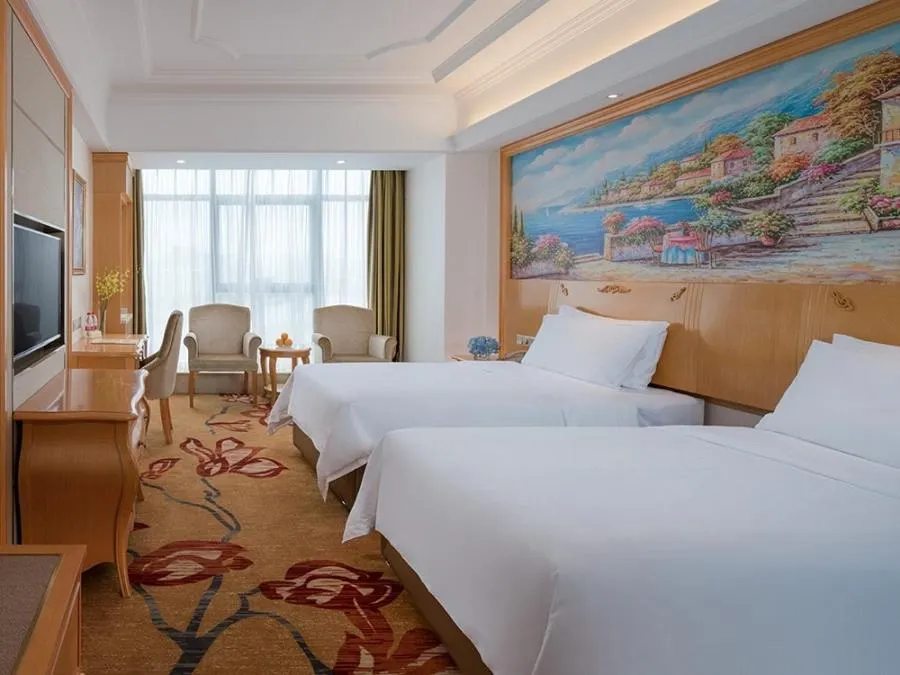 Bed in Vienna International Hotel Changsha Shumuling Subway Station