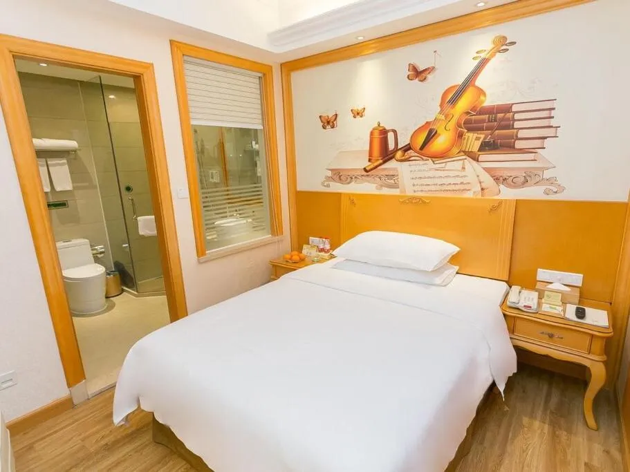 Bed in Vienna Hotel Guangzhou Beijing Road