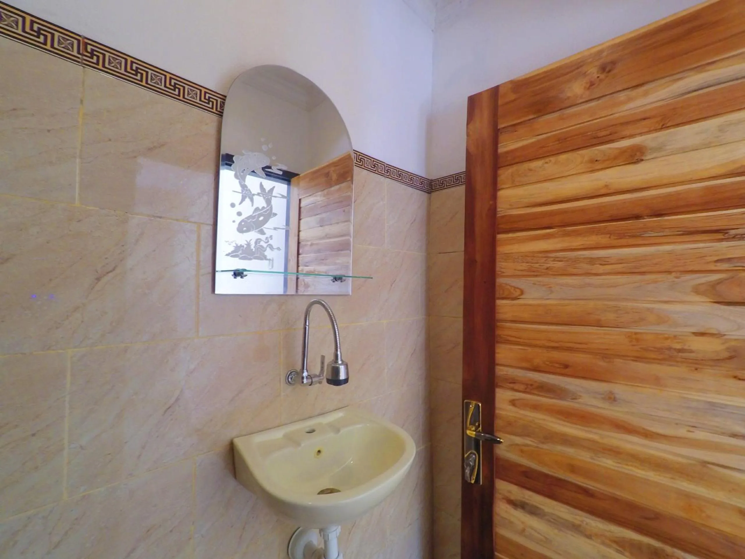Bathroom in Tropical Garden Inn