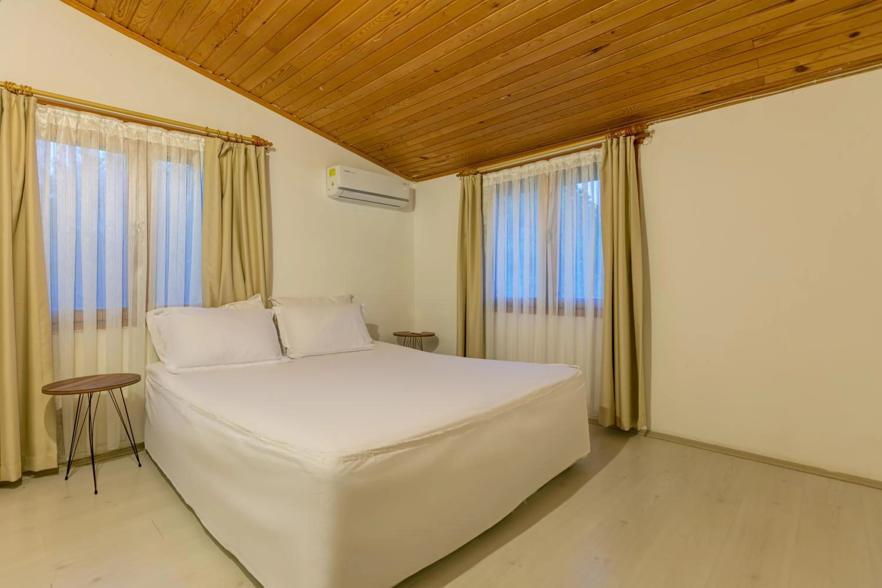 Bed in Etenna Beach Bungalows