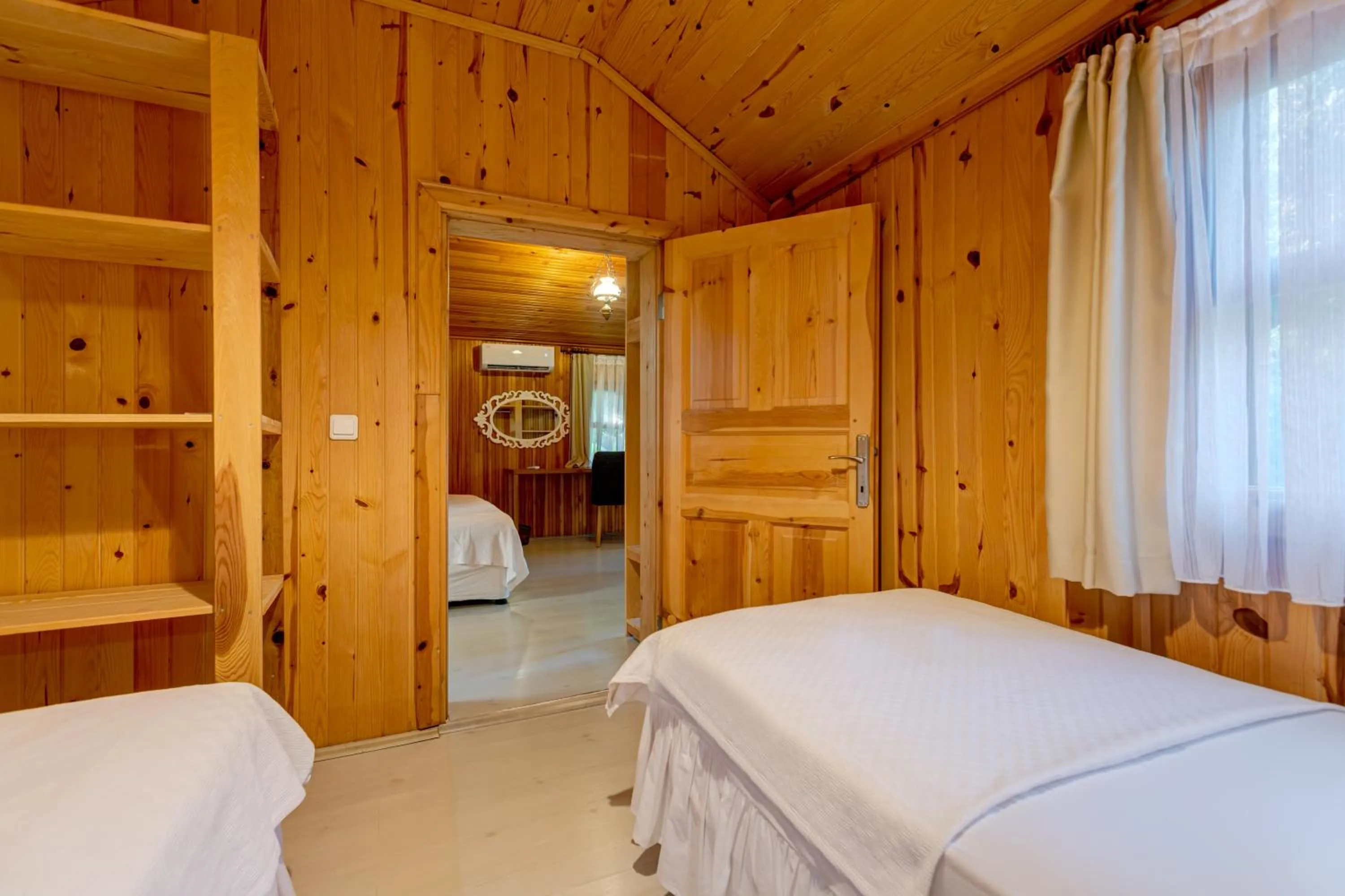 Bed in Etenna Beach Bungalows