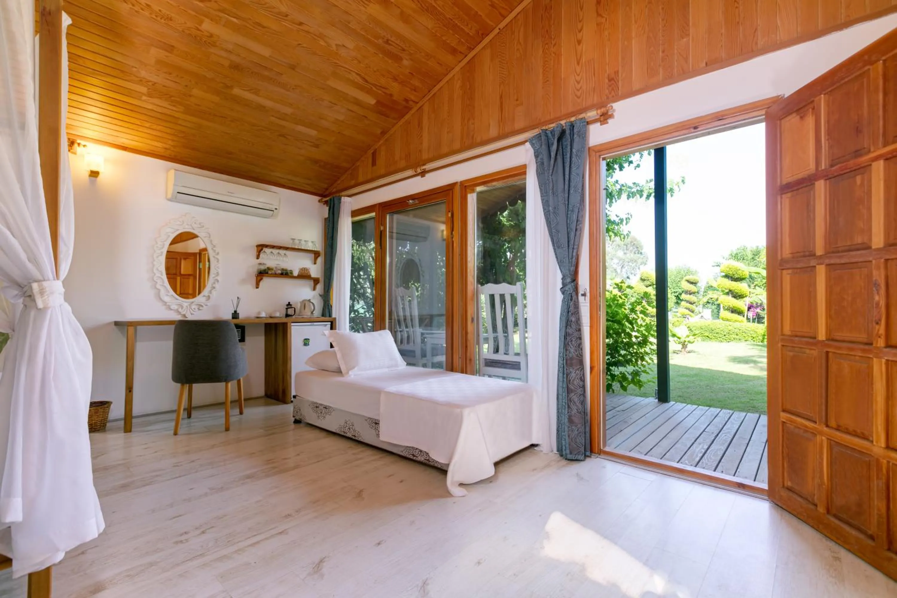 Bed in Etenna Beach Bungalows