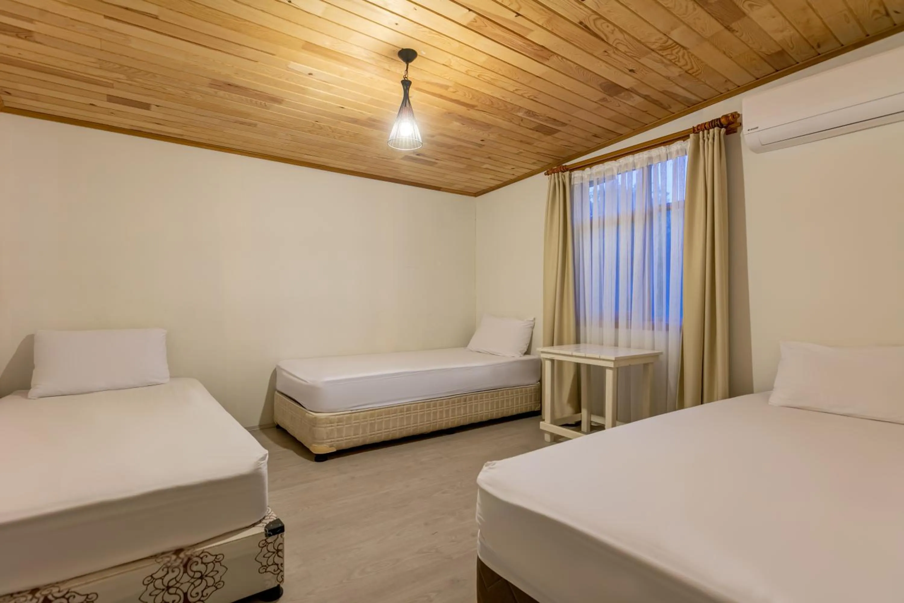 Bed in Etenna Beach Bungalows