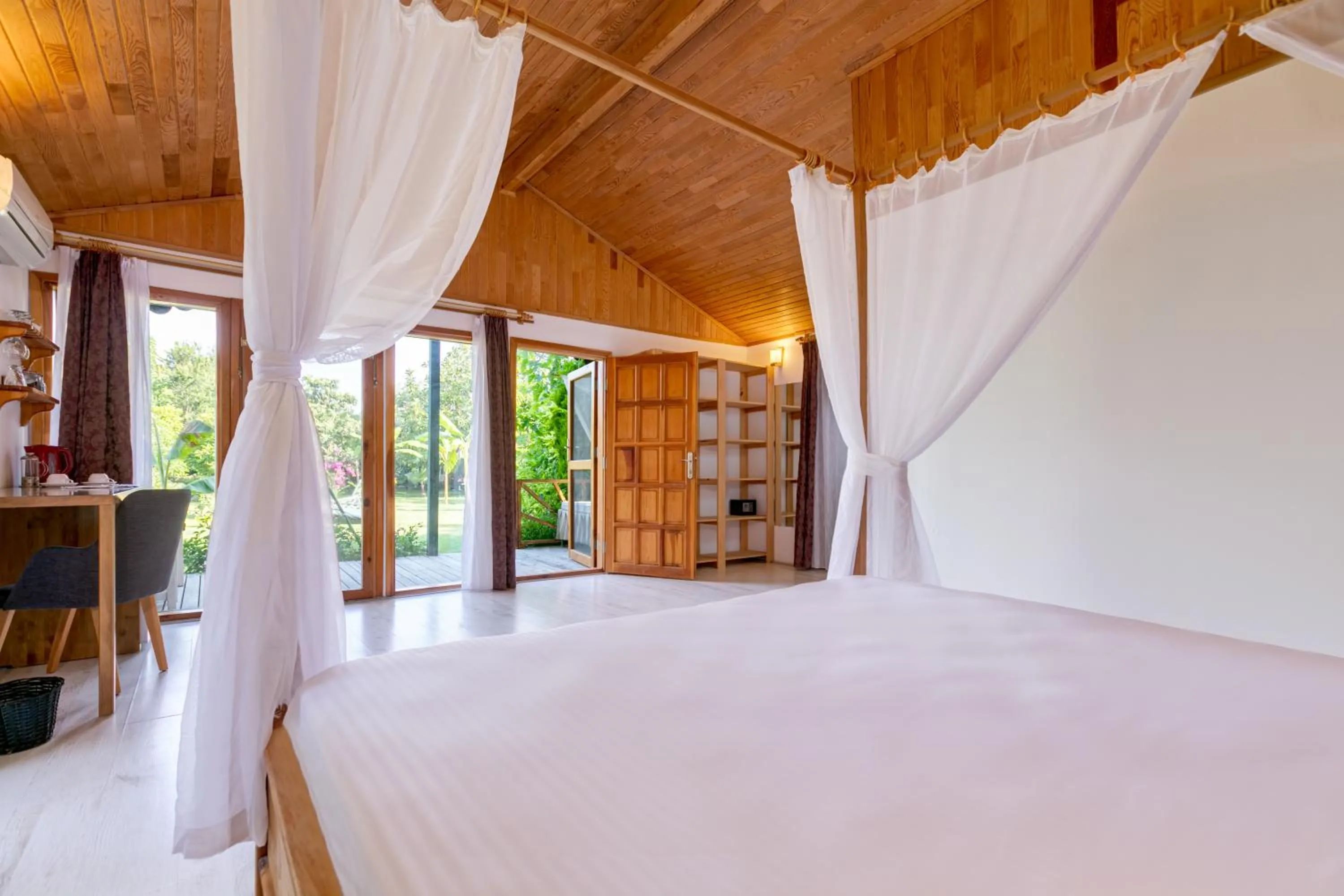 Bed in Etenna Beach Bungalows