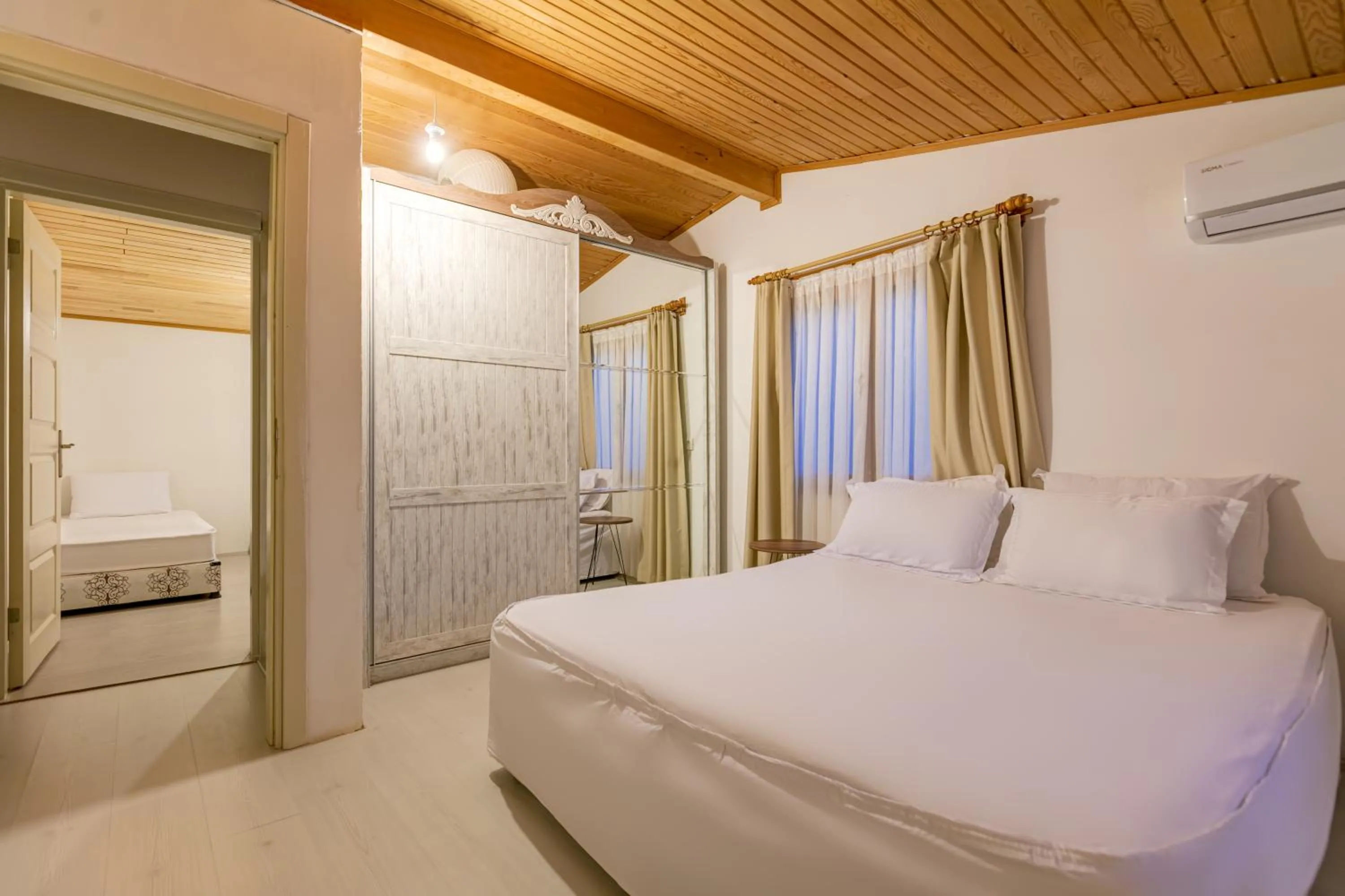 Bed in Etenna Beach Bungalows