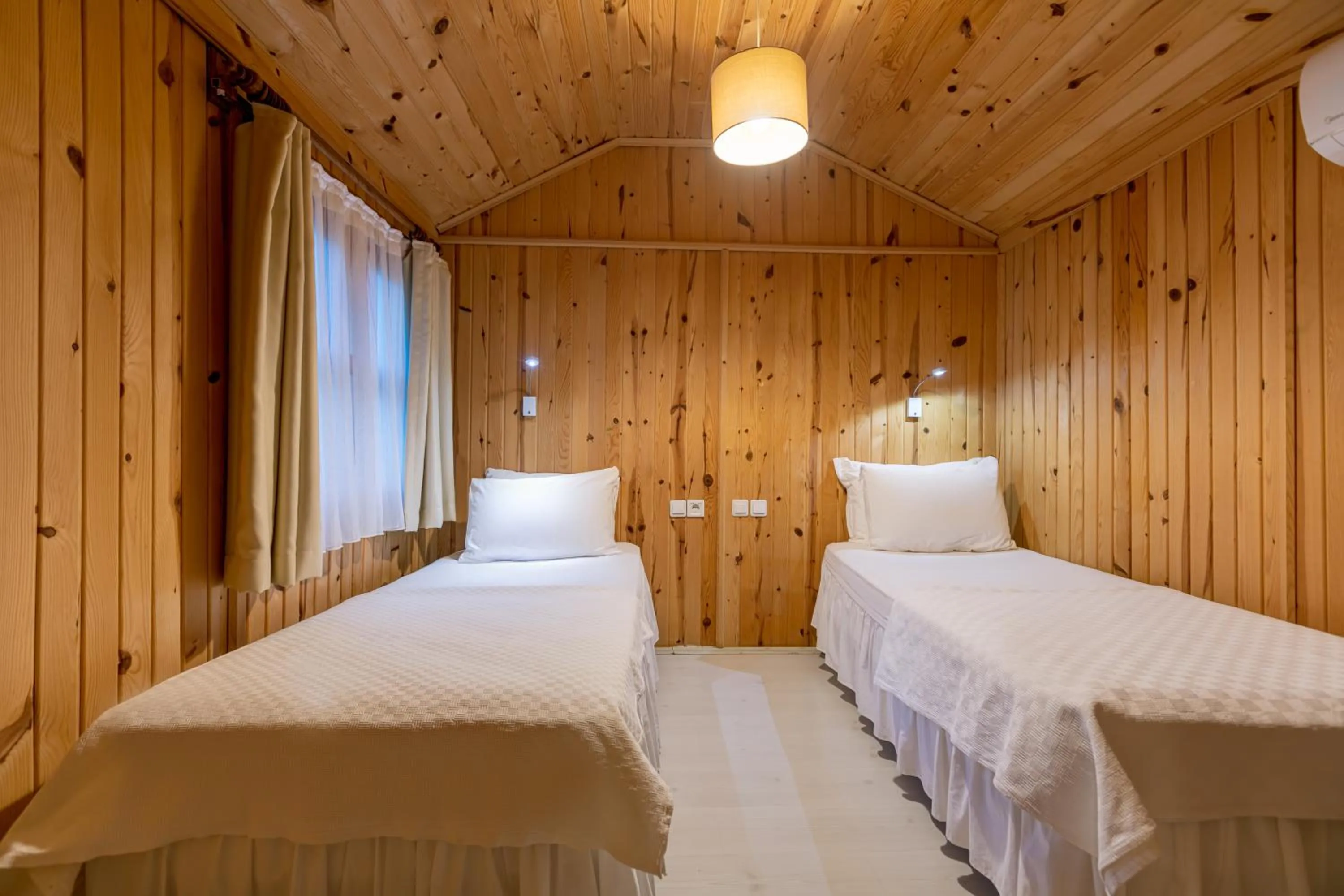 Bed in Etenna Beach Bungalows