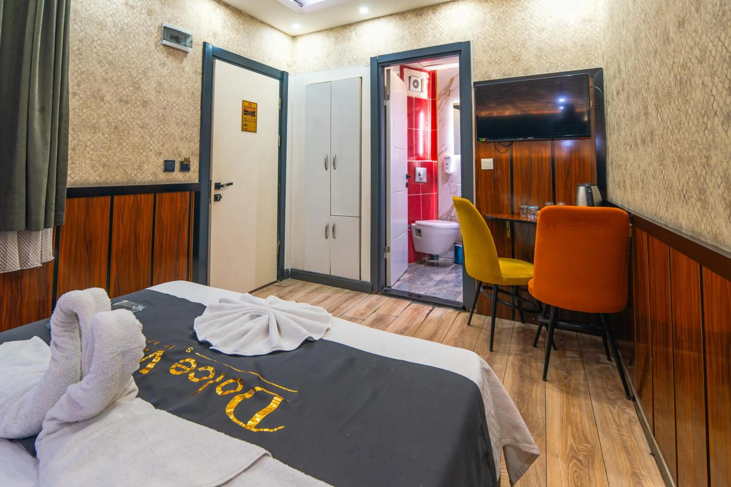 Bed in Dolce Vita Suite Hotel