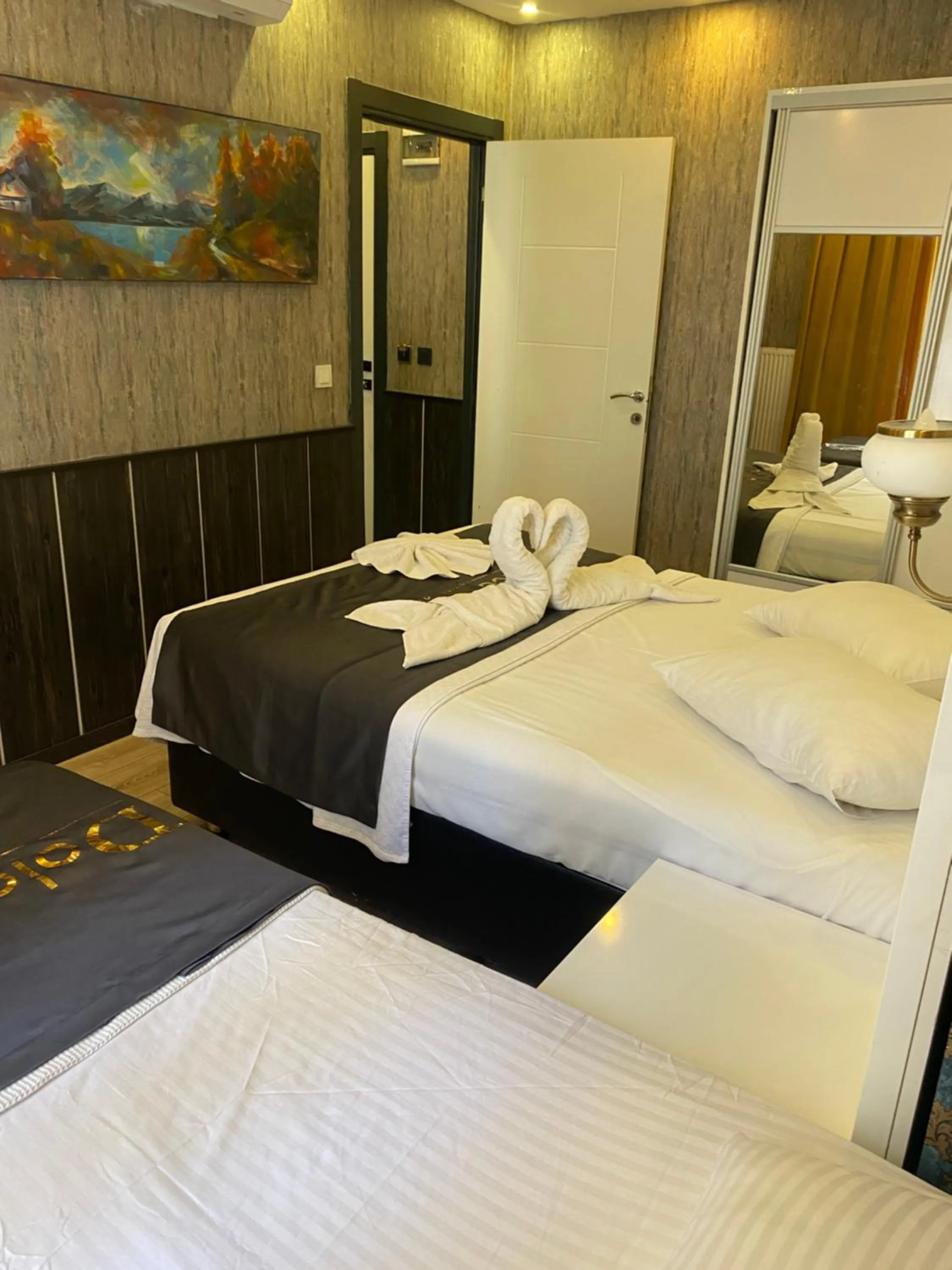 Bed in Dolce Vita Suite Hotel