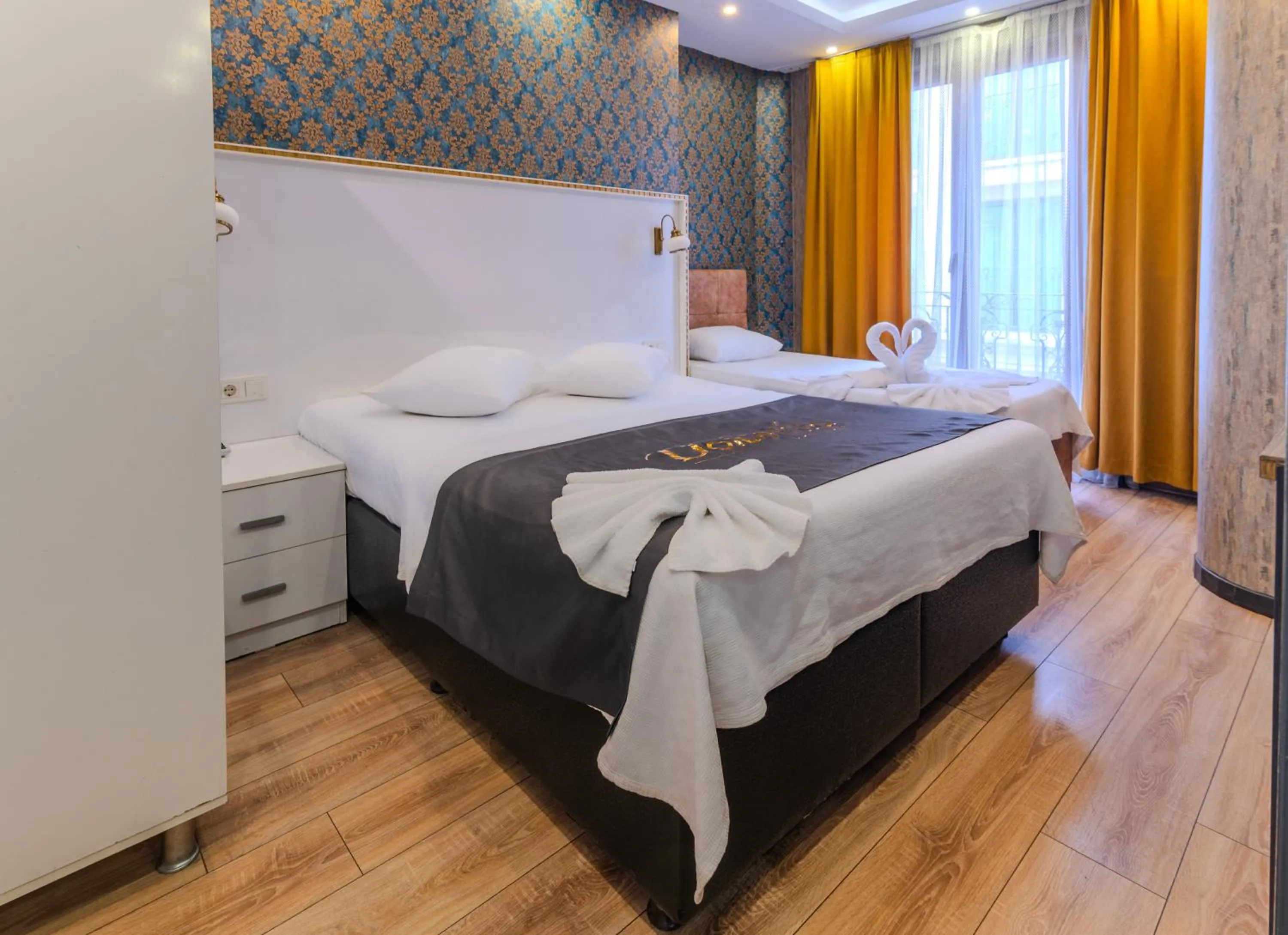 Bed in Dolce Vita Suite Hotel