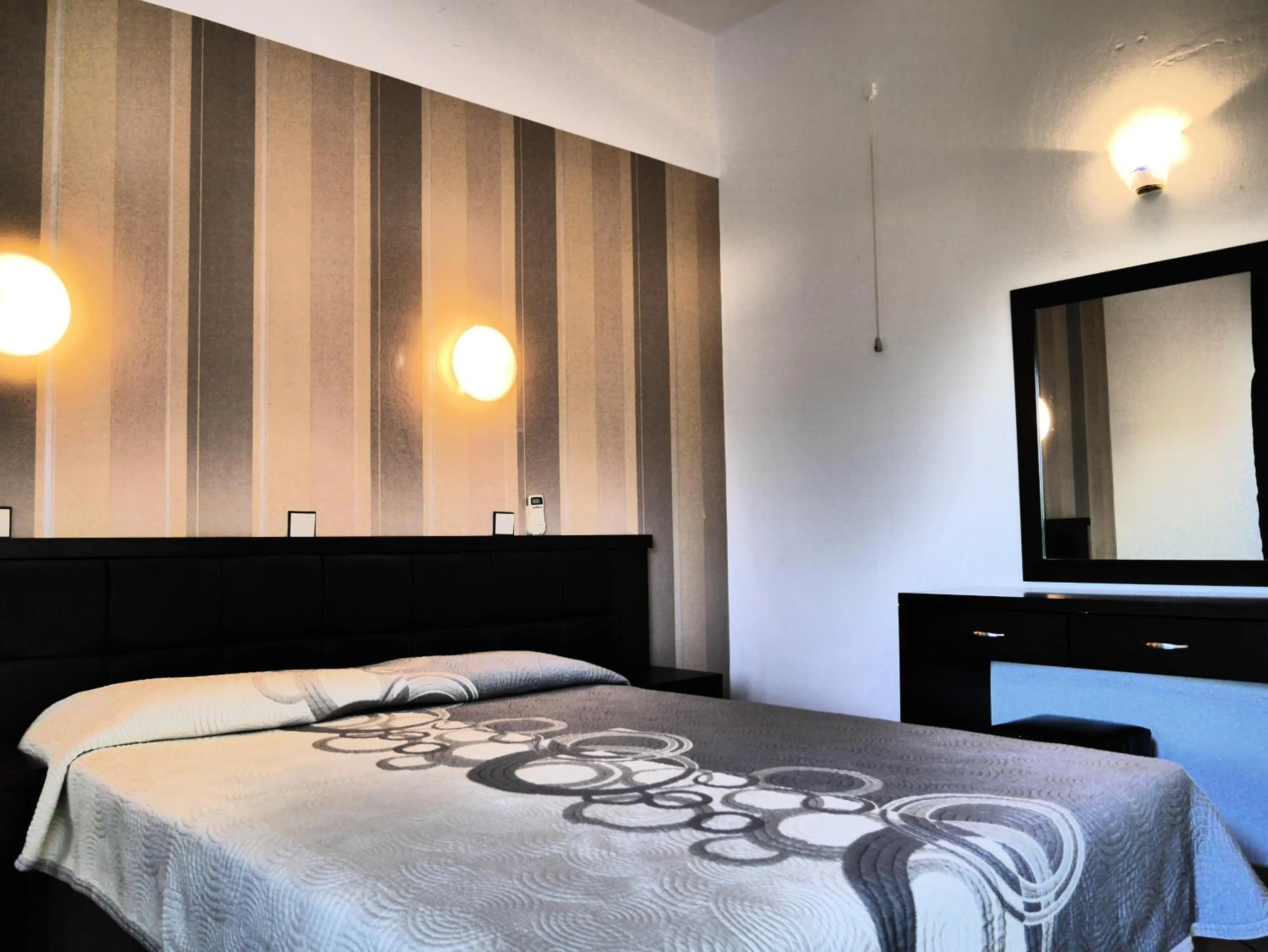 Bed in Blue Bay Beach Hotel