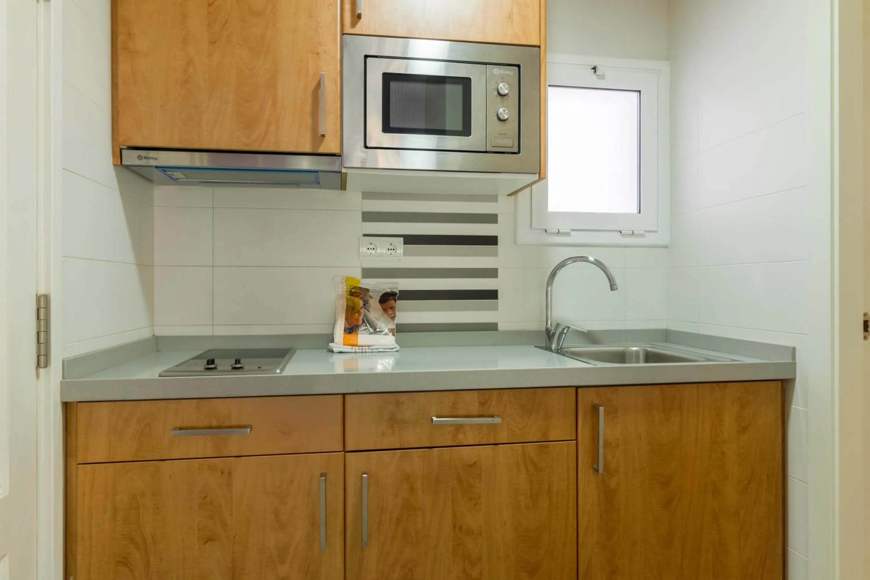 Kitchen or kitchenette in Apartamentos Sunway San Jorge
