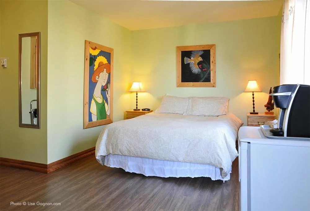 Bed in La Galouine Auberge