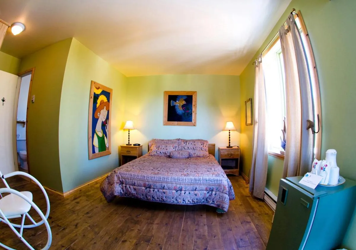 Bed in La Galouine Auberge