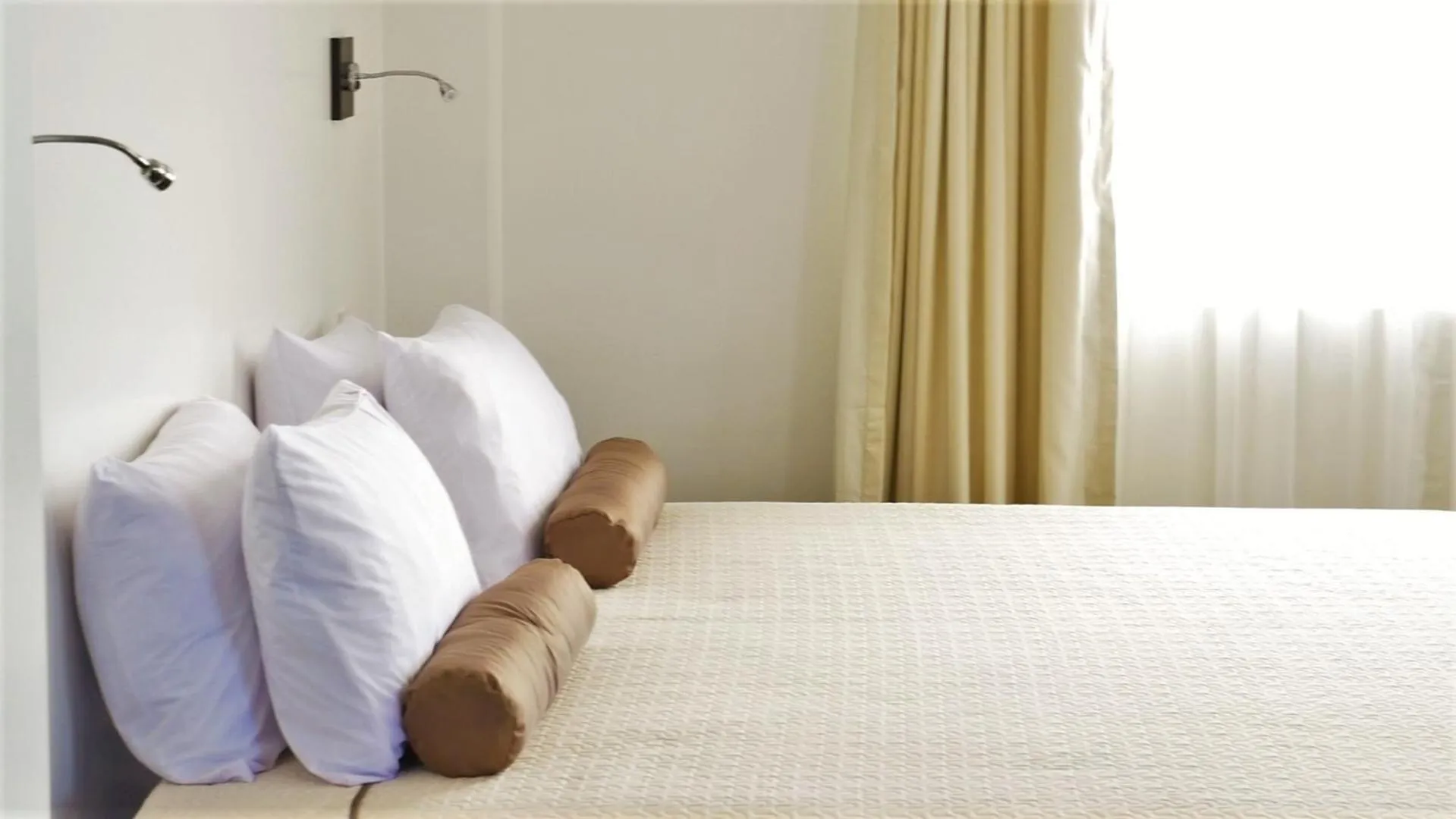 Bed in Ikala Galapagos Hotel