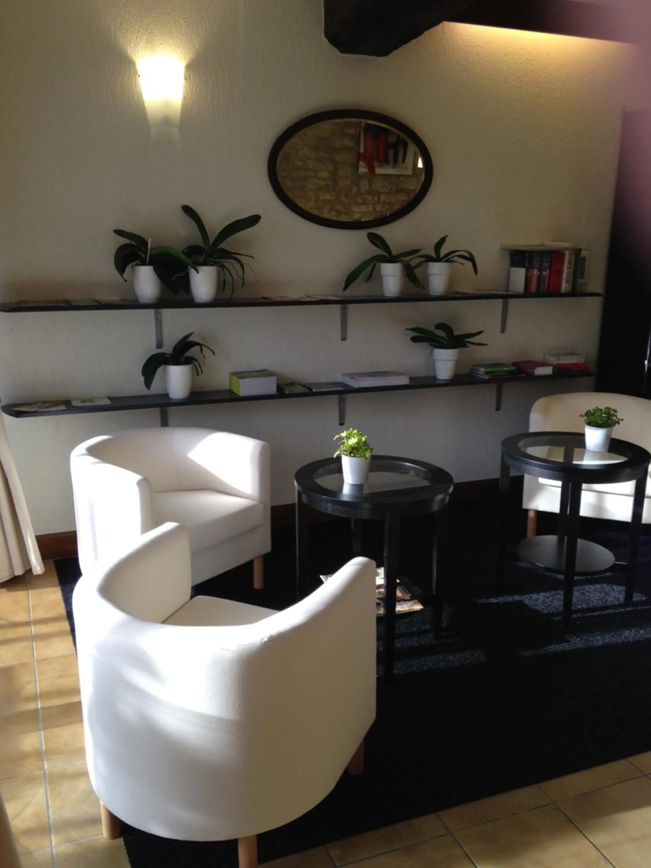 Communal lounge/ TV room in Logis Hôtel Restaurant La Bastide