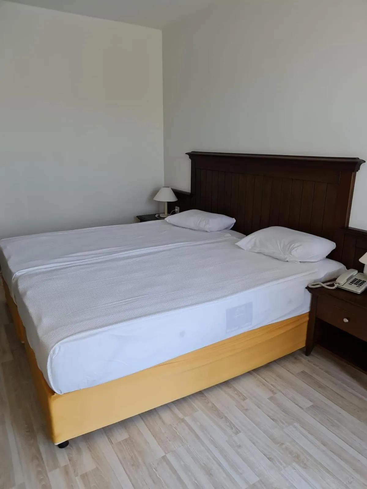 Bed in Side Palm D'or Hotel