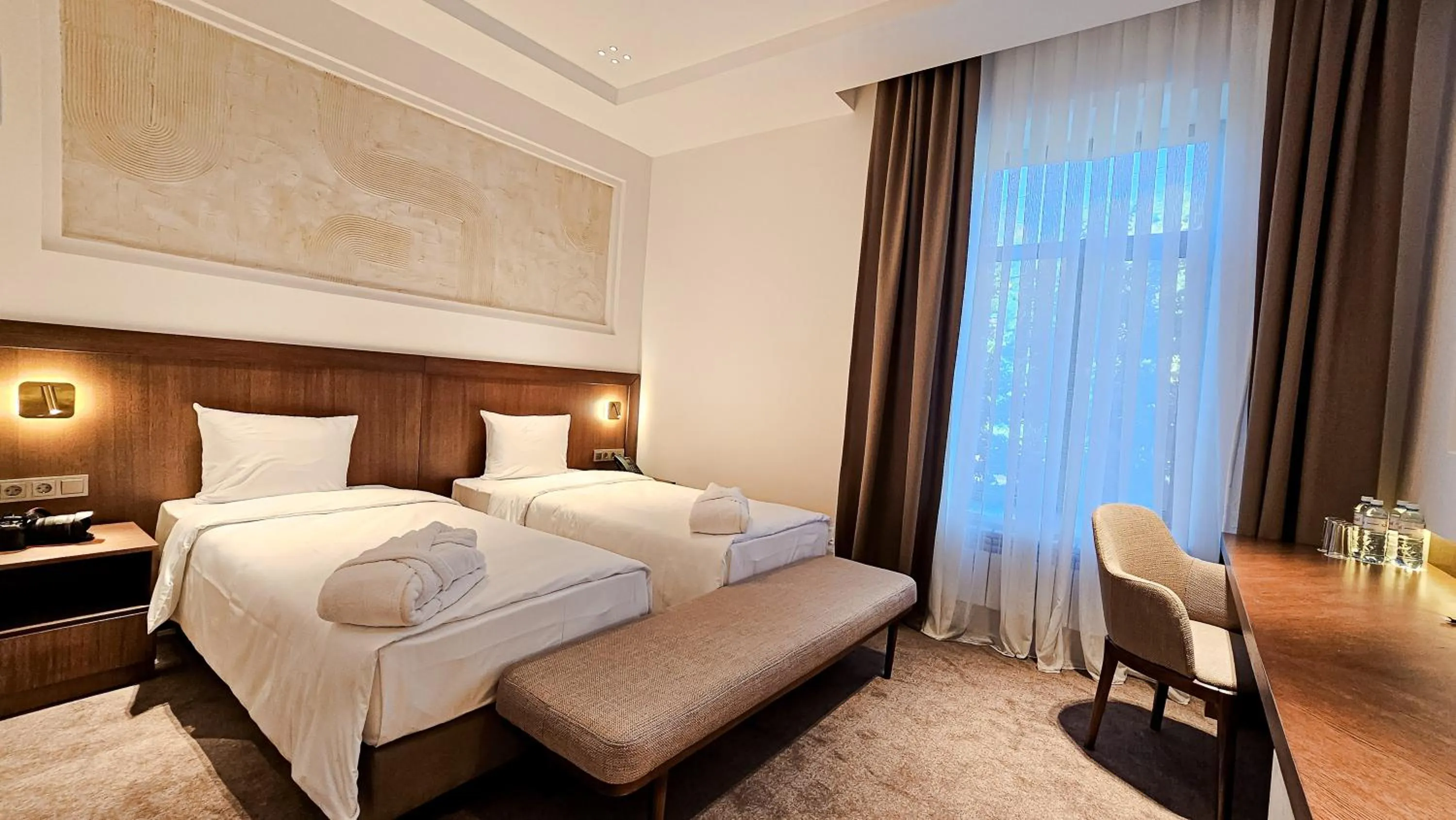 Bed in Grand Tien Shan Hotel