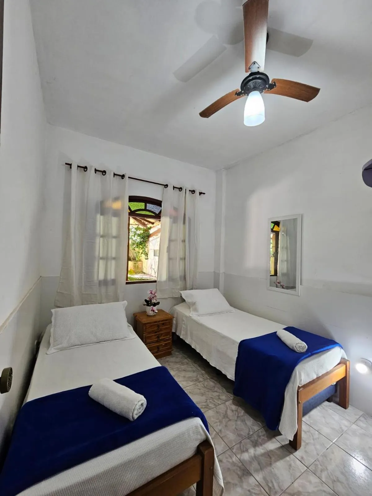 Bed in Pousada Recanto Das Emerências