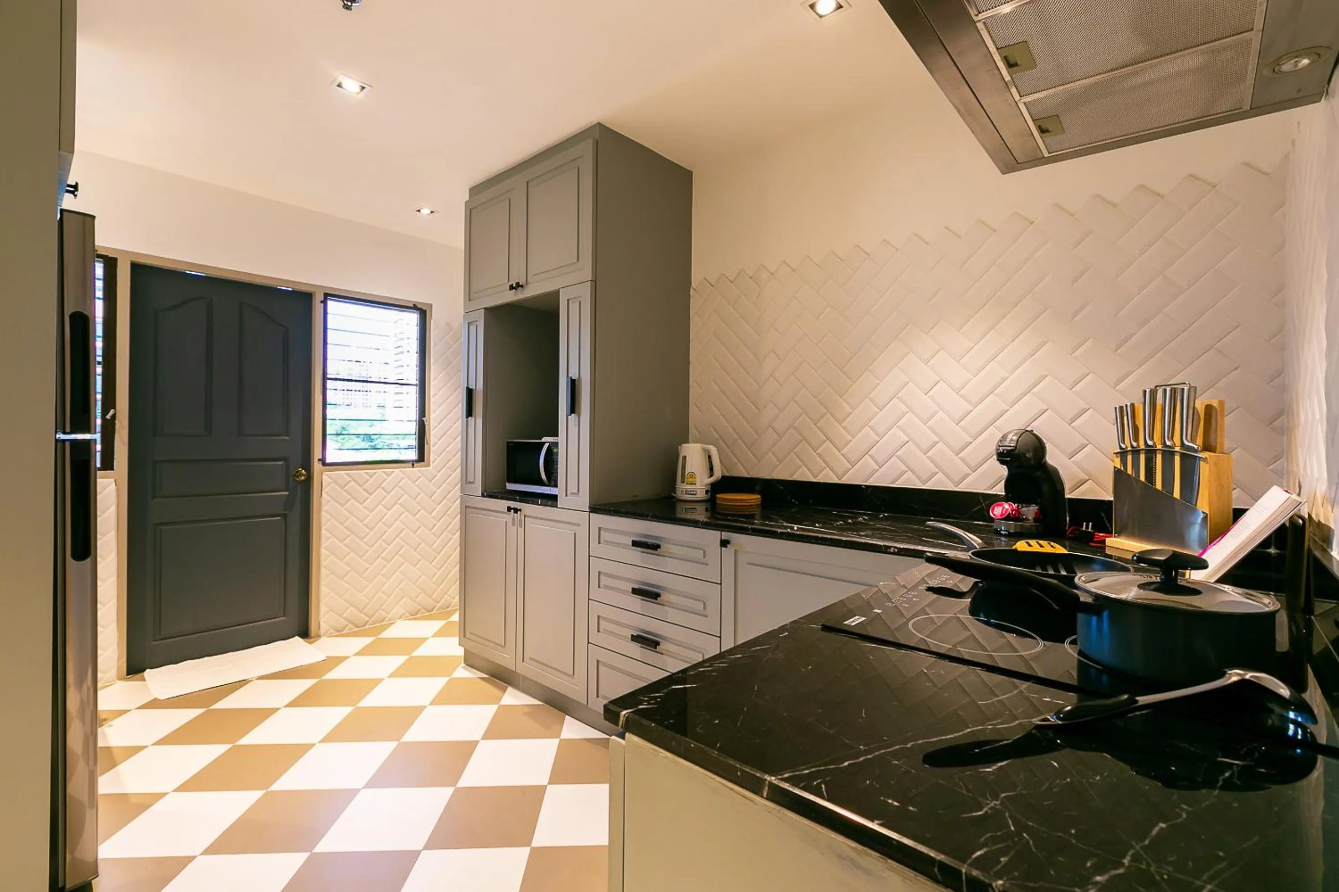 kitchen in THEA Private Suites by TH District