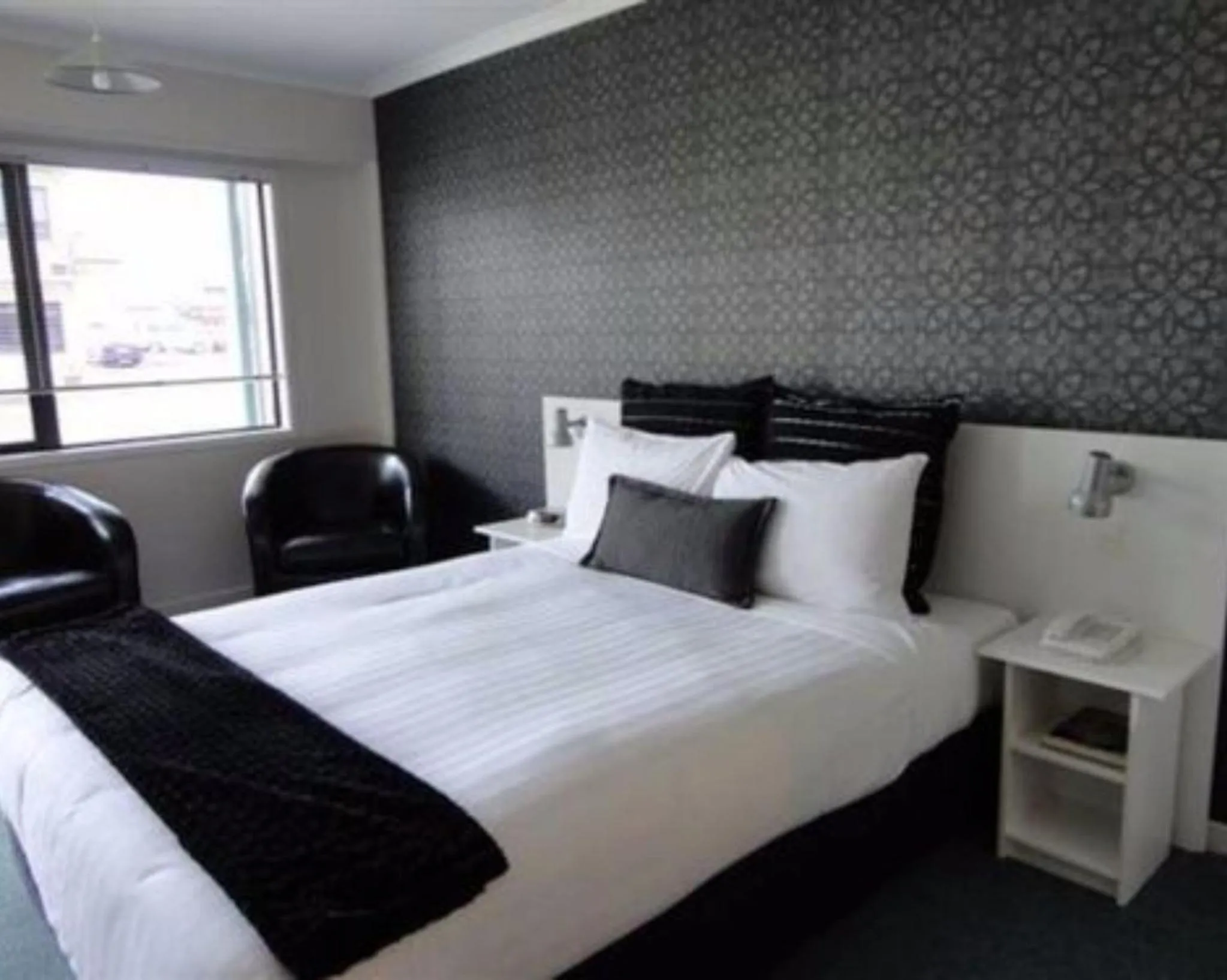 Bed in ASURE Abode On Courtenay Motor Inn