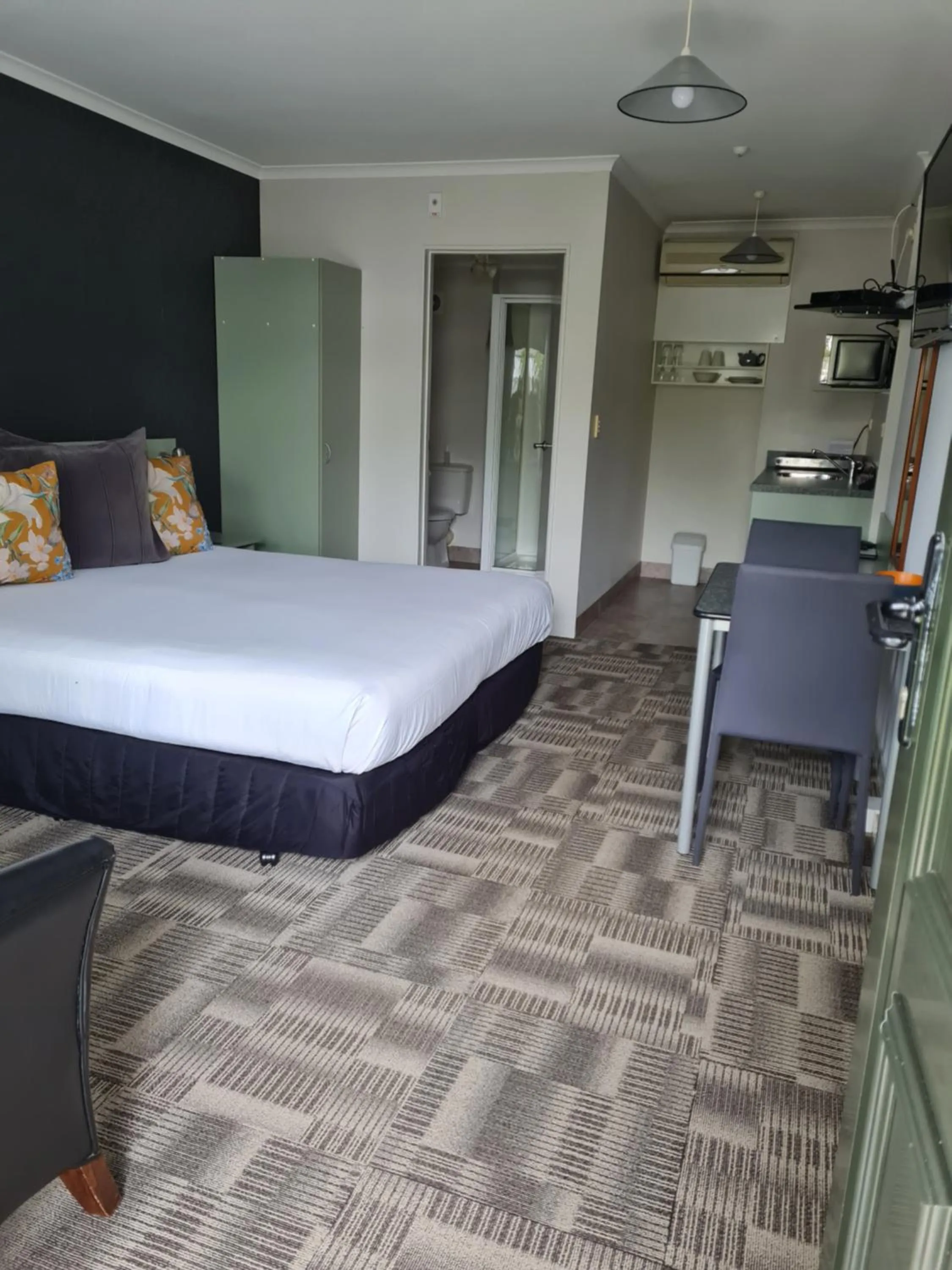 Bed in ASURE Abode On Courtenay Motor Inn