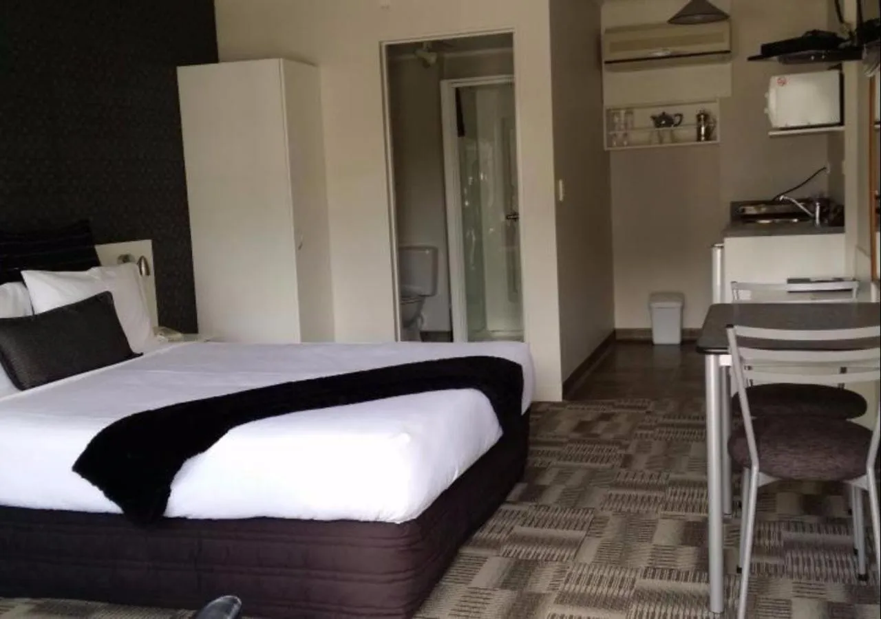 Bed in ASURE Abode On Courtenay Motor Inn