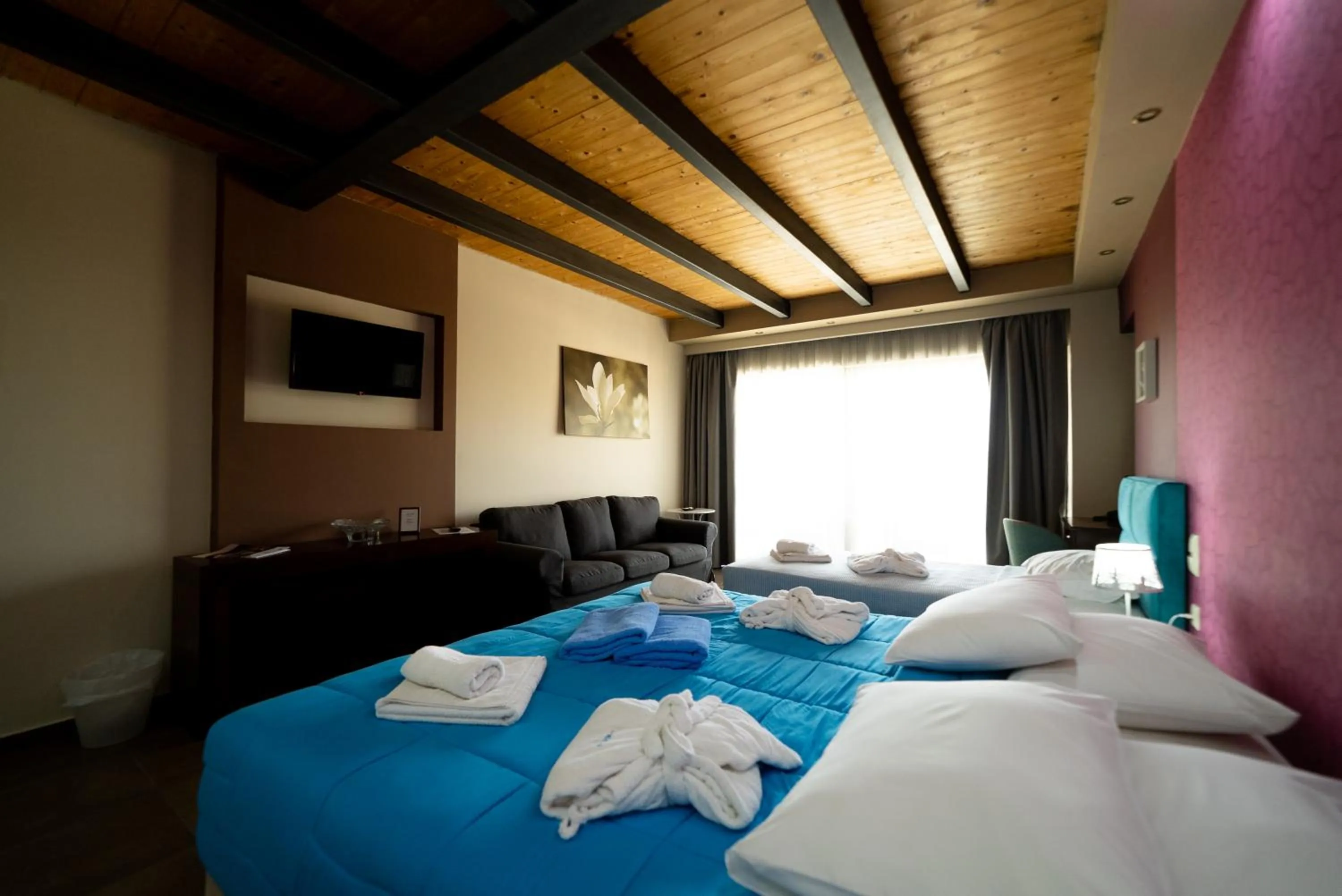 Bed in Ornella Beach Resort & Villas