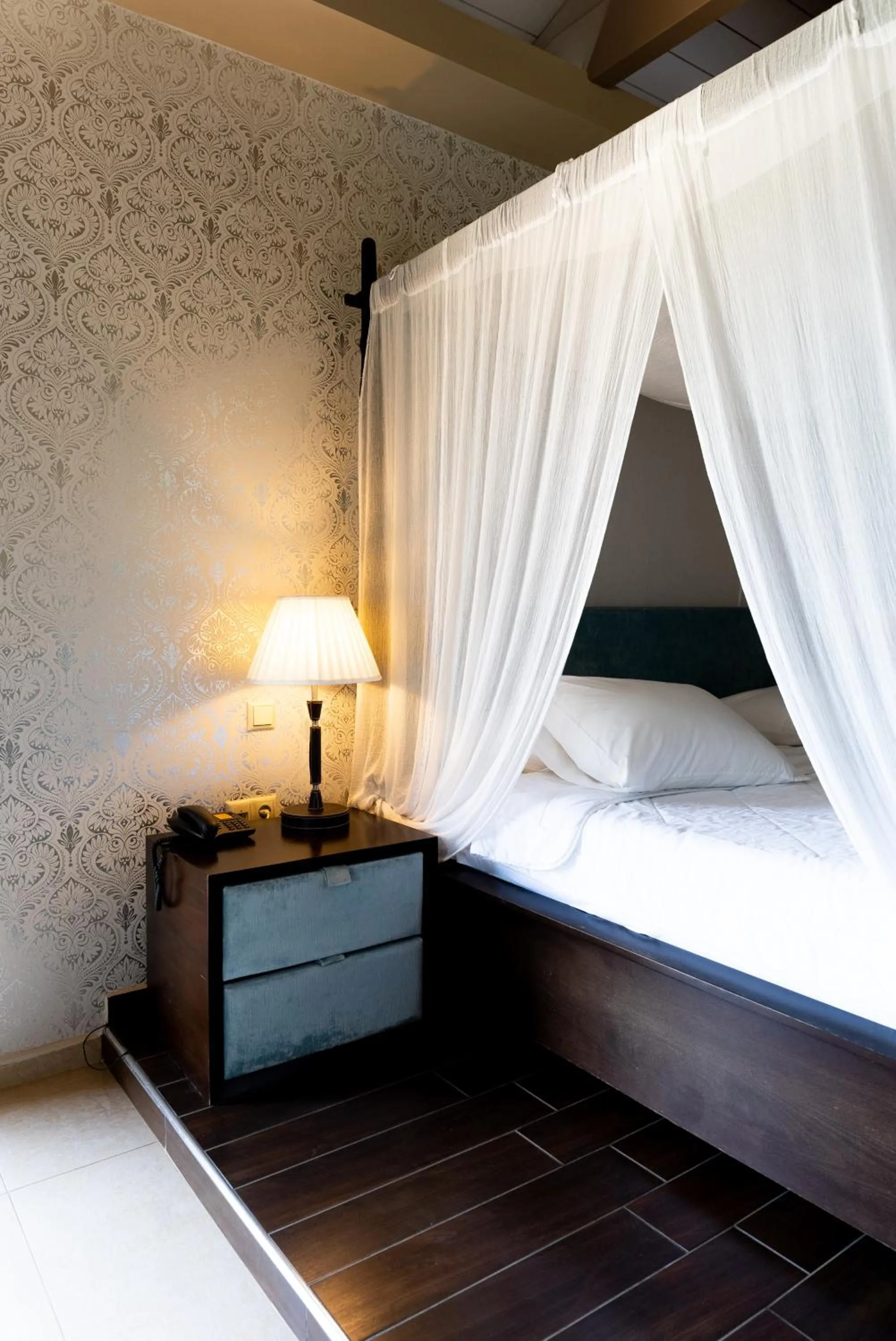 Bed in Ornella Beach Resort & Villas