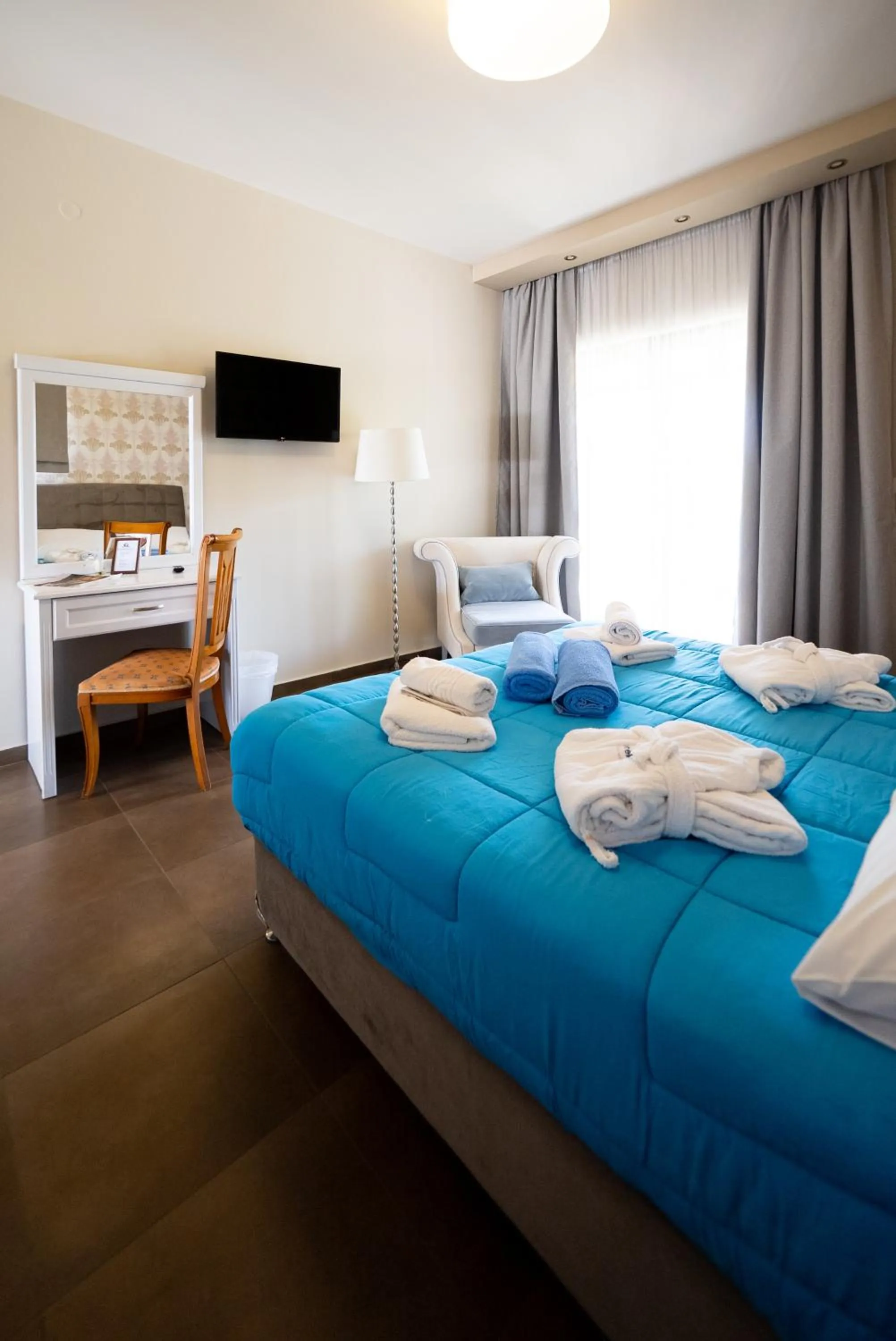 Bed in Ornella Beach Resort & Villas