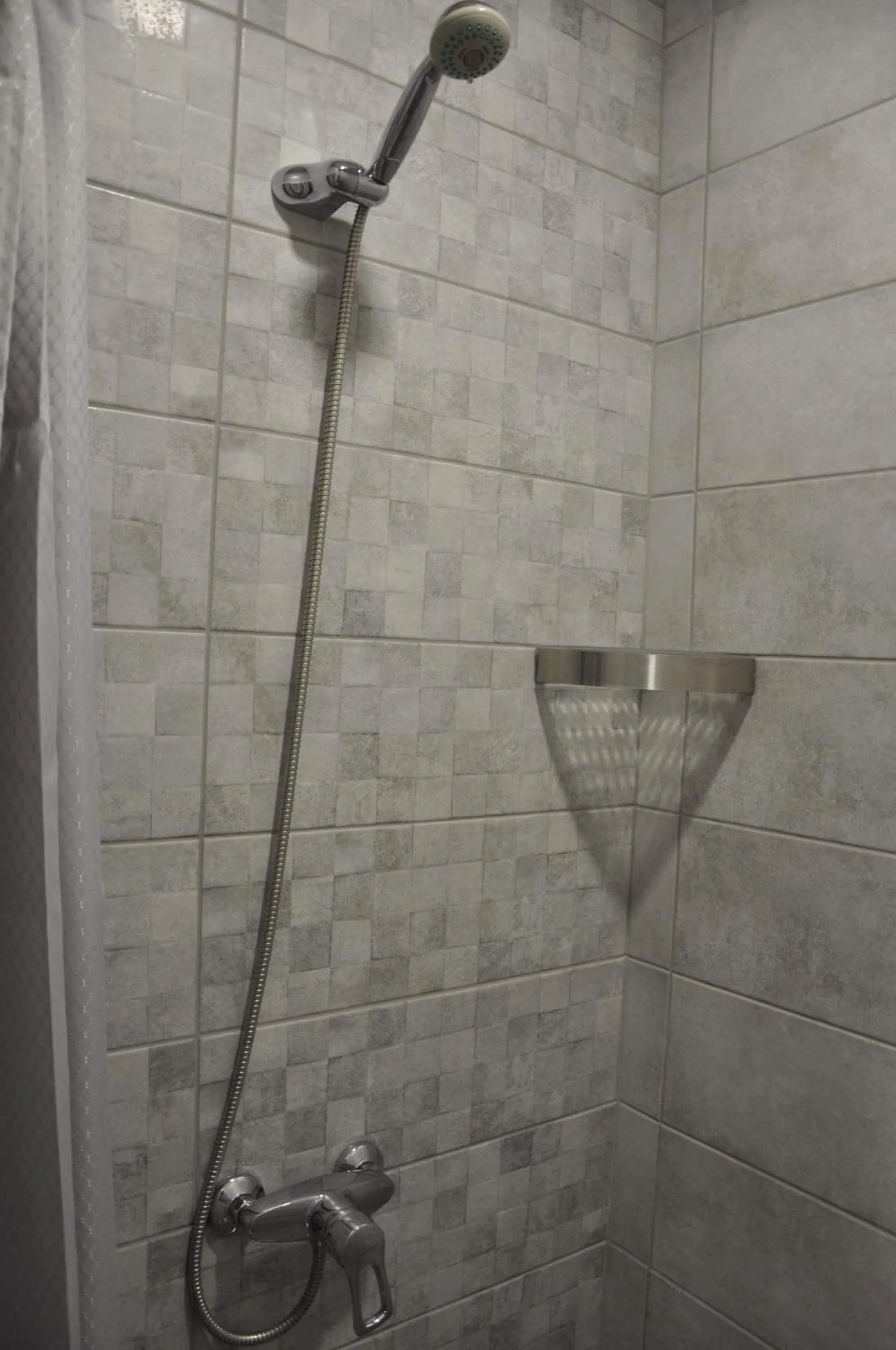 Shower in FULL HOUSE capsule hostel
