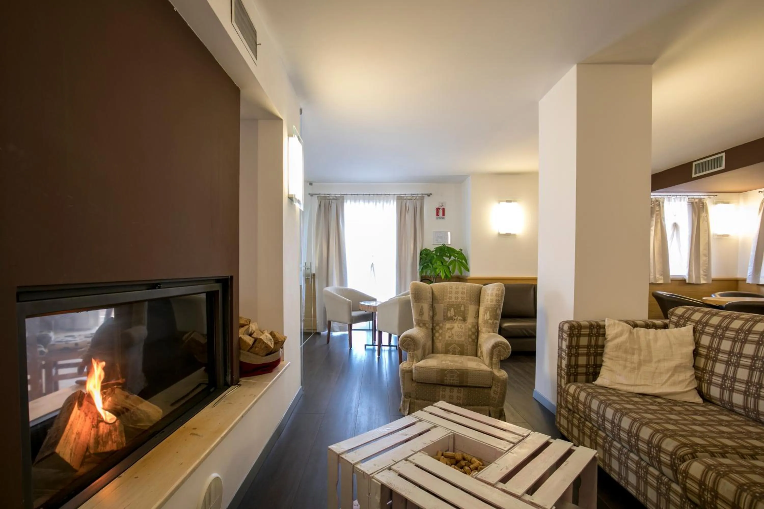 Communal lounge/ TV room in Hotel Luna Bianca Folgaria