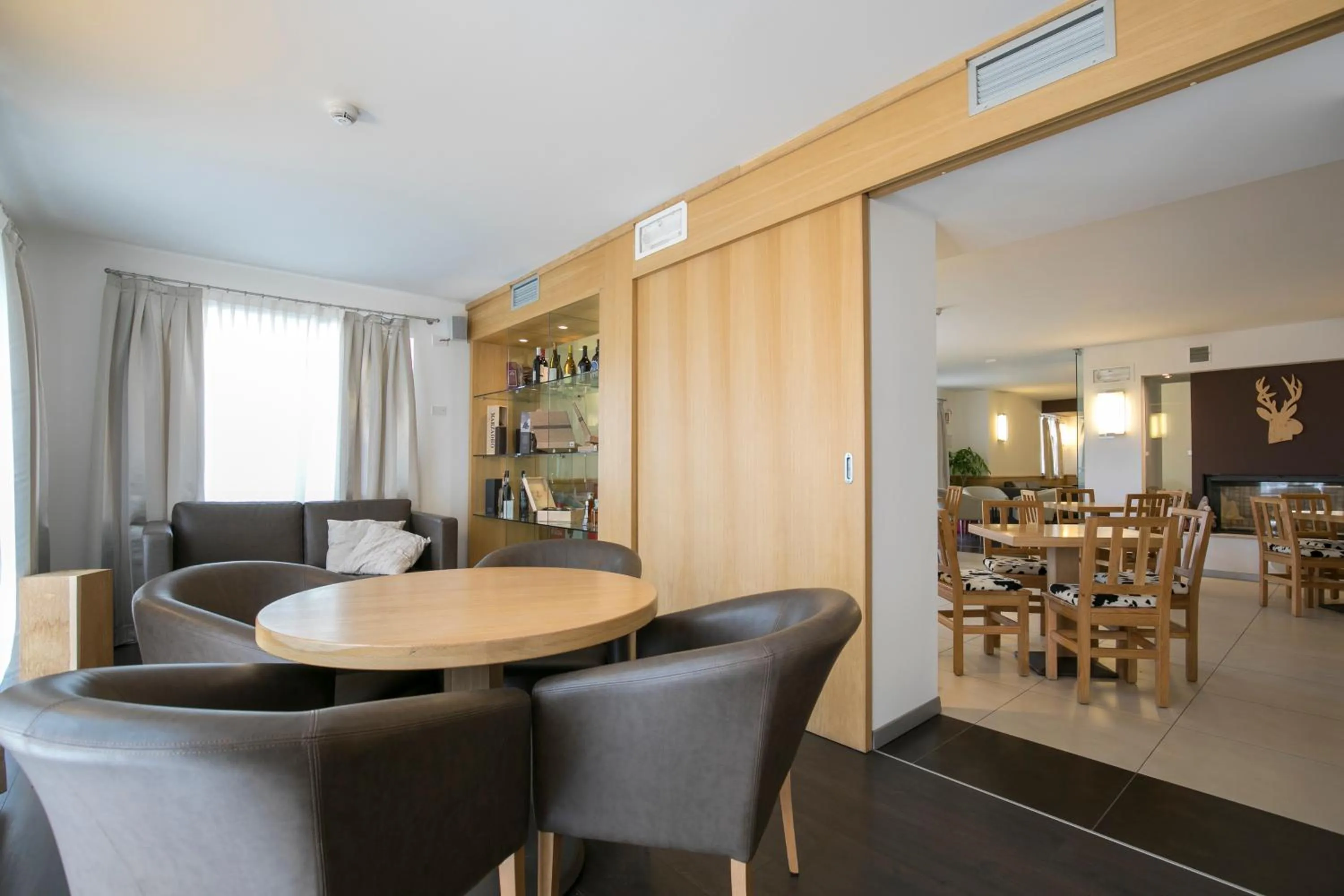 Communal lounge/ TV room in Hotel Luna Bianca Folgaria