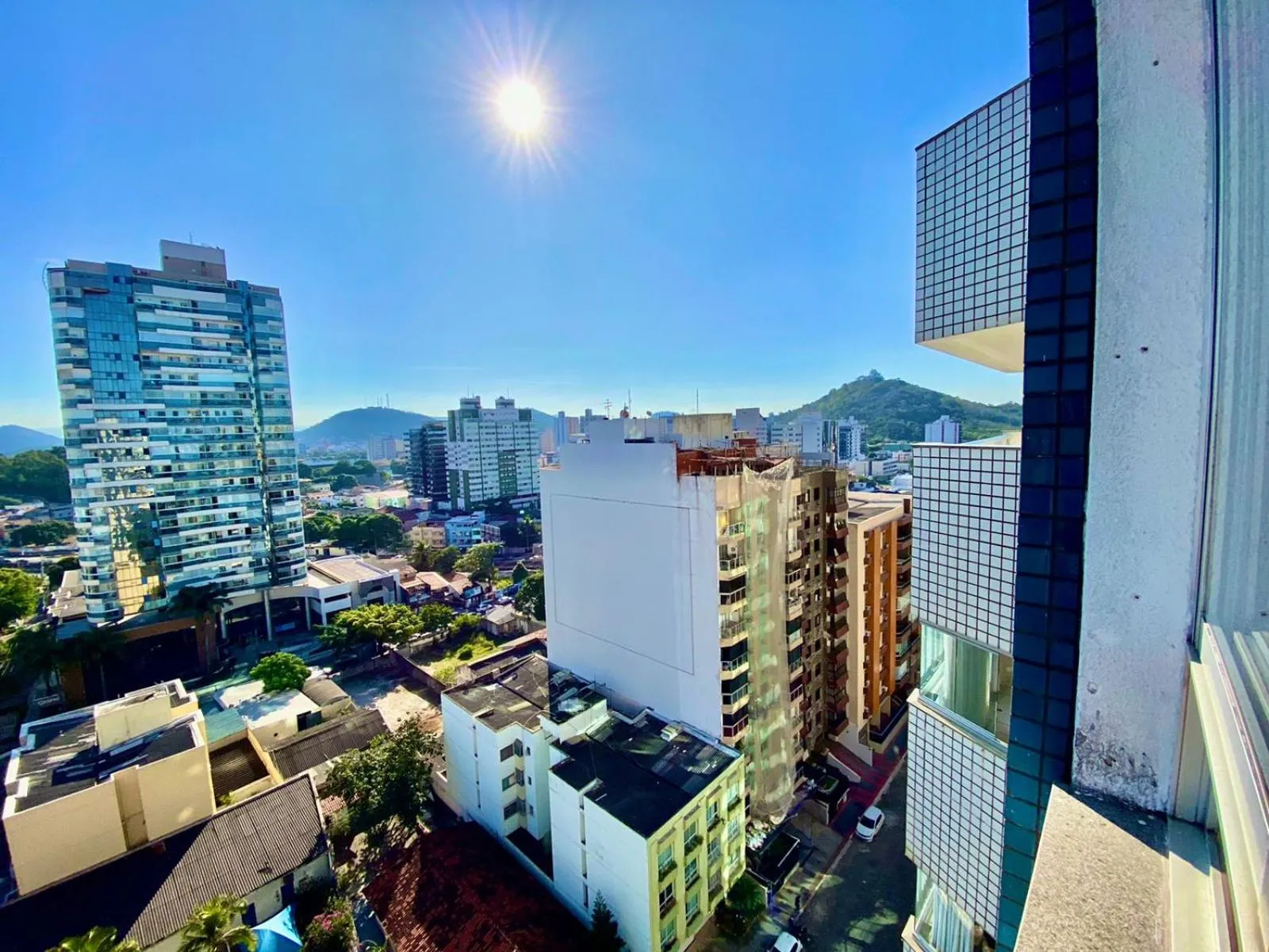 Property building in Quartos em Homestay Praia da Costa