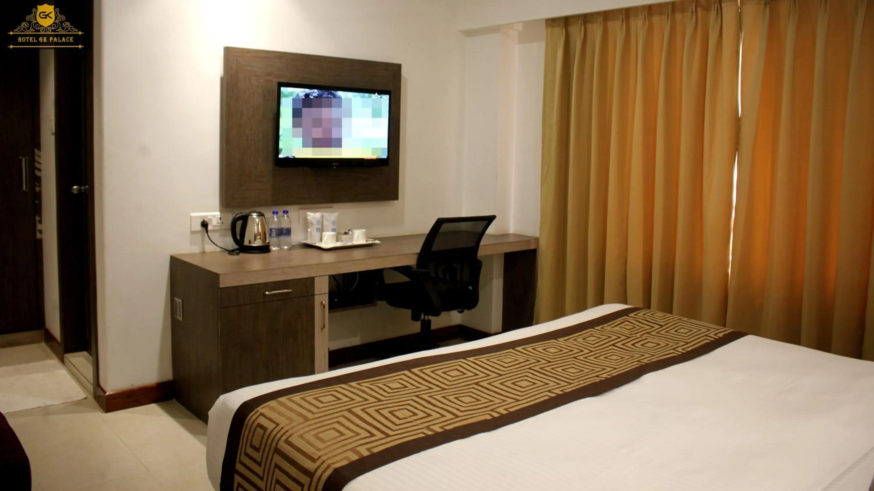 Bed in GK PALACE Pure VEG Hotel