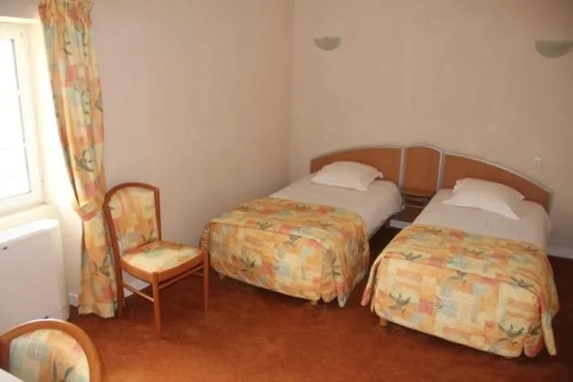 Bed in Logis Hôtel de France restaurant le Lucullus