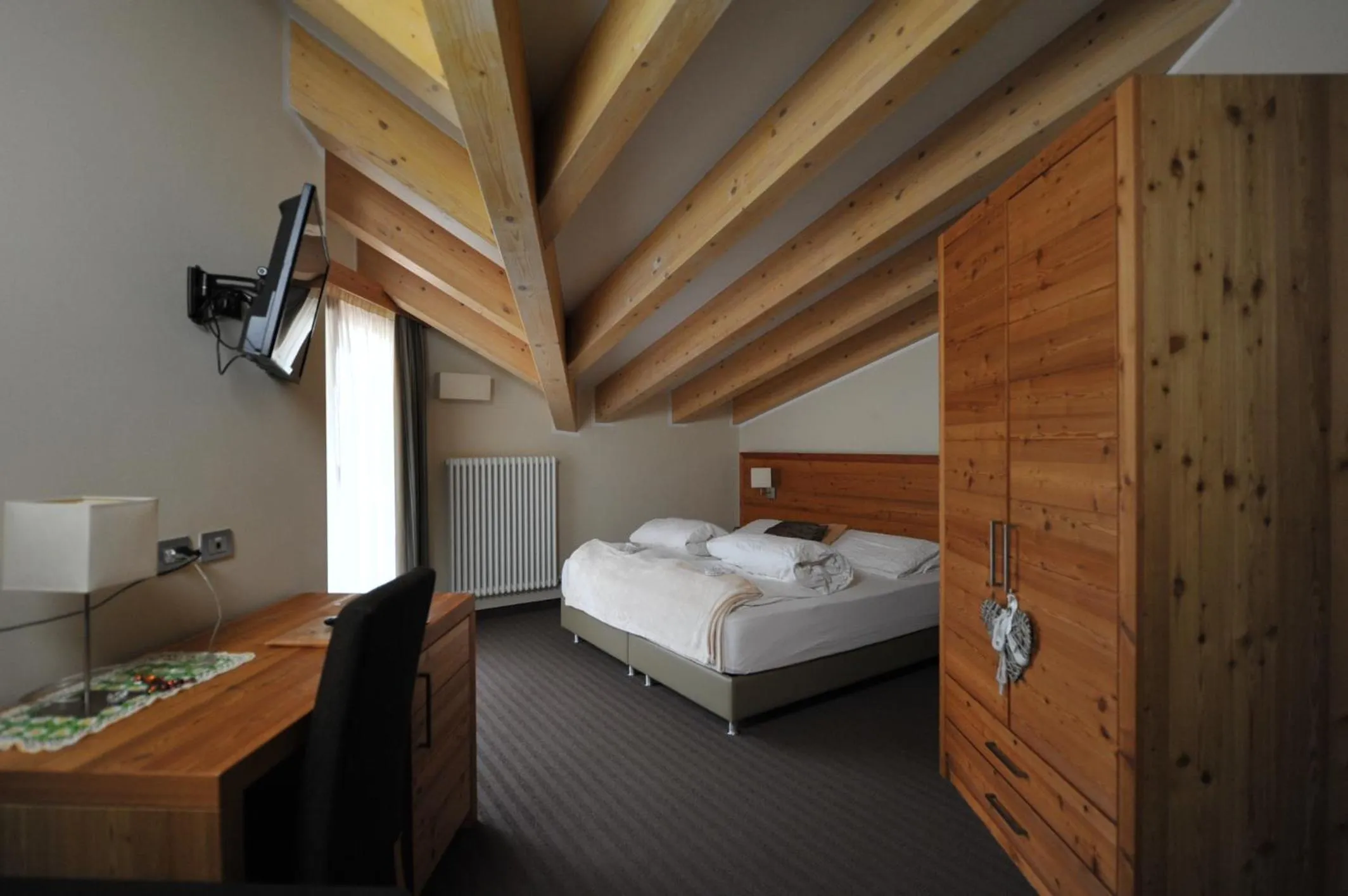 Bed in Bio Hotel Brusago Vital & Wellness