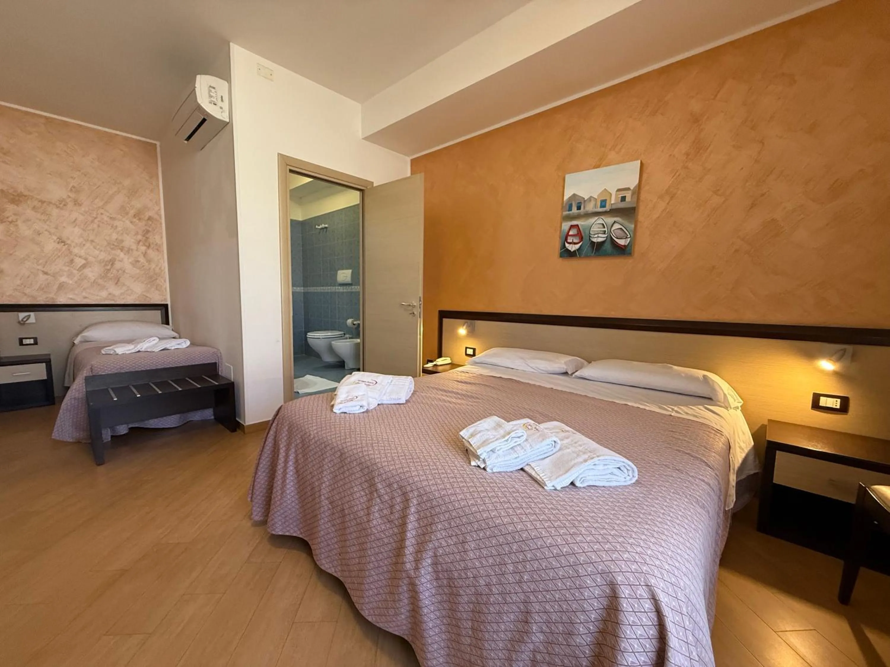 Bed in Albergo Perseo