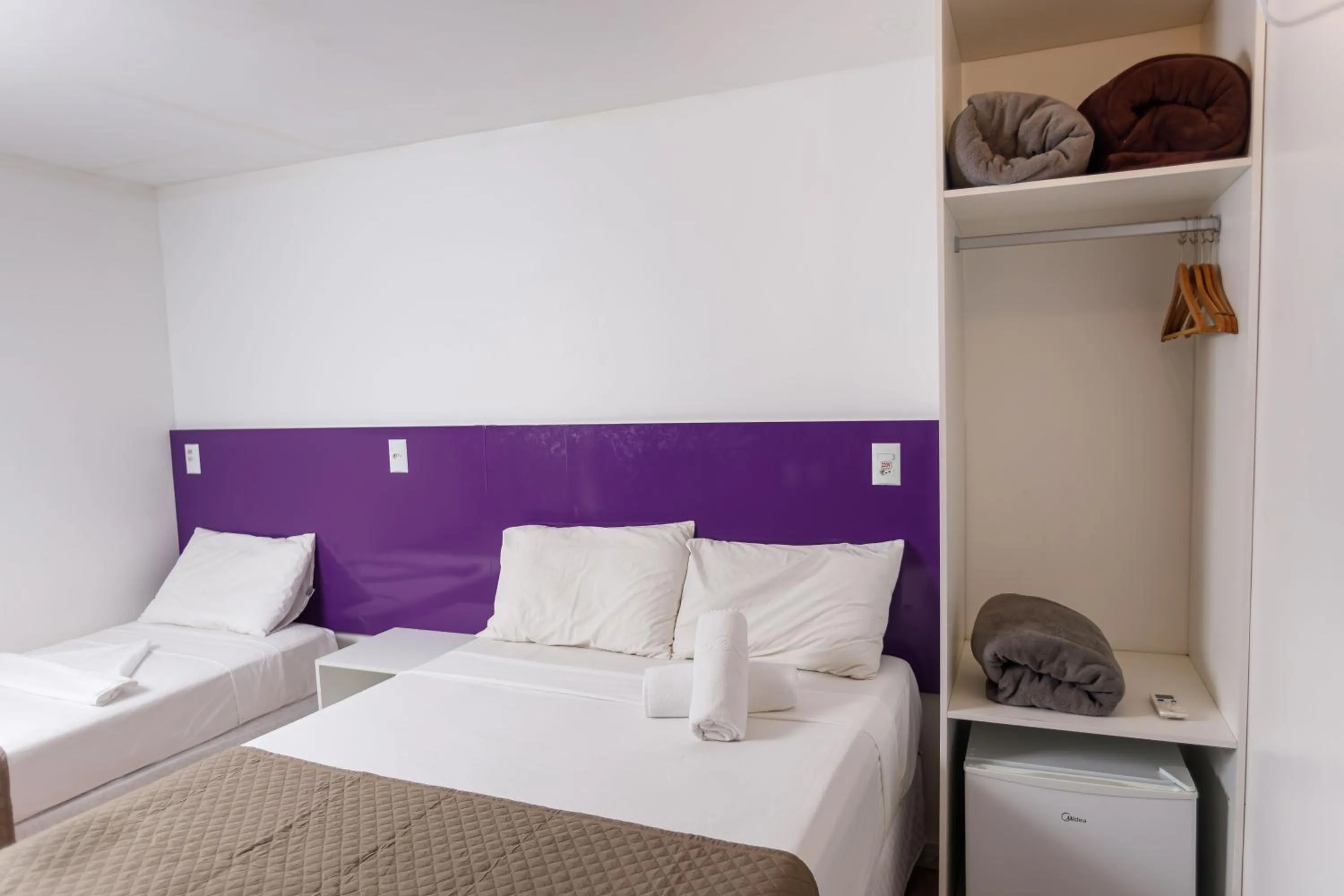 towels, Bed in Zuza Slim Suítes