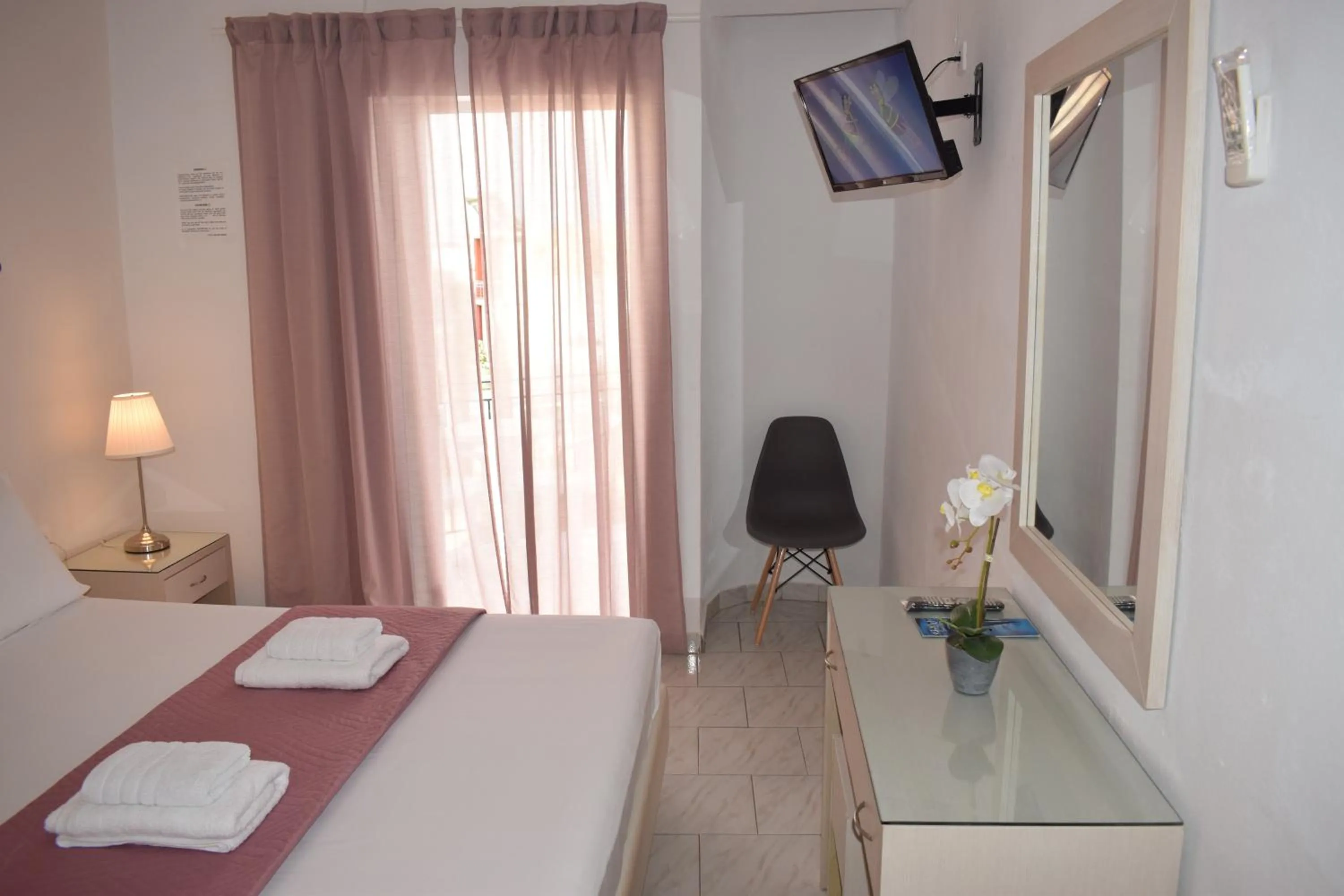 Communal lounge/ TV room in Mirto Beach Hotel & Restaurant