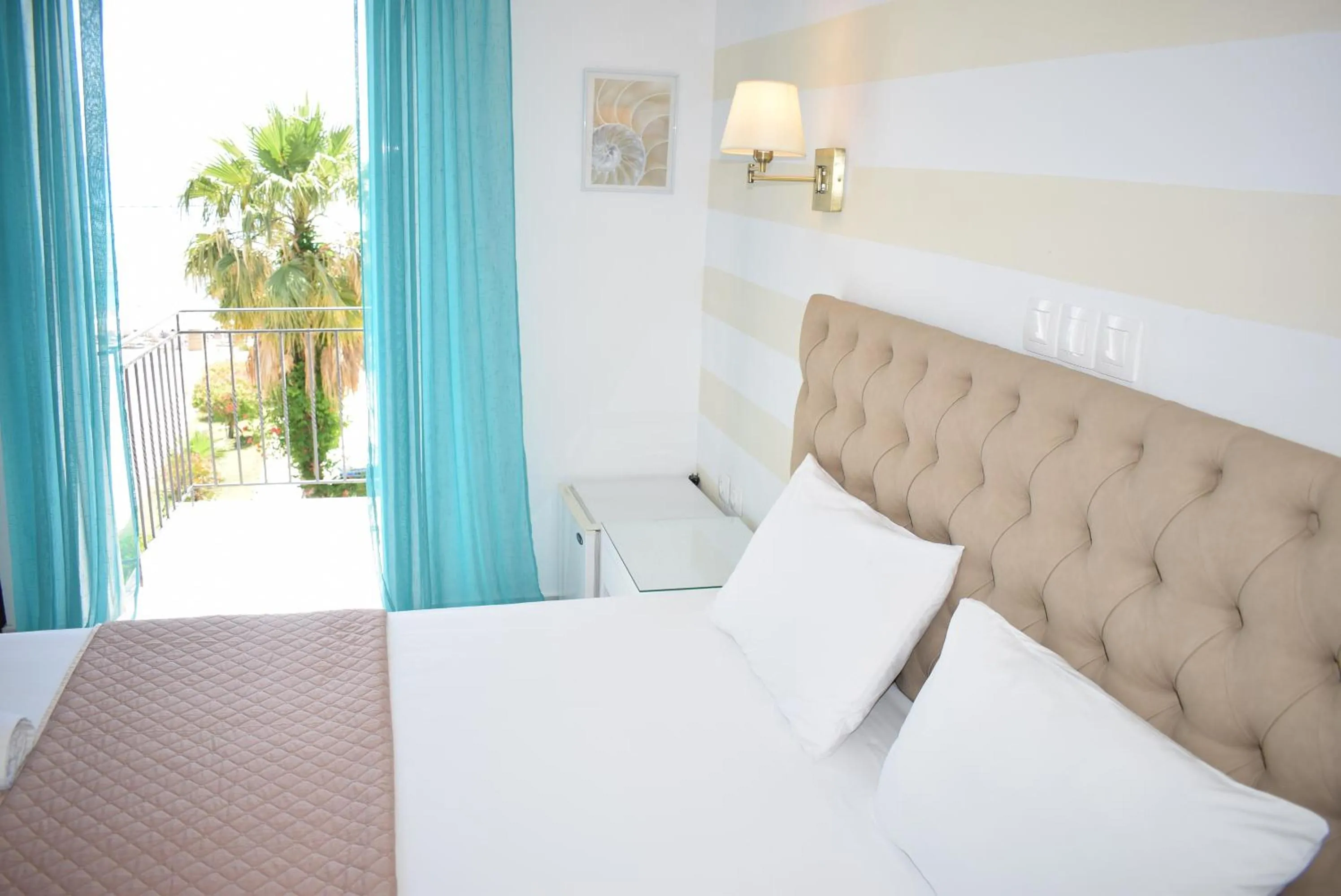 Bed in Mirto Beach Hotel & Restaurant