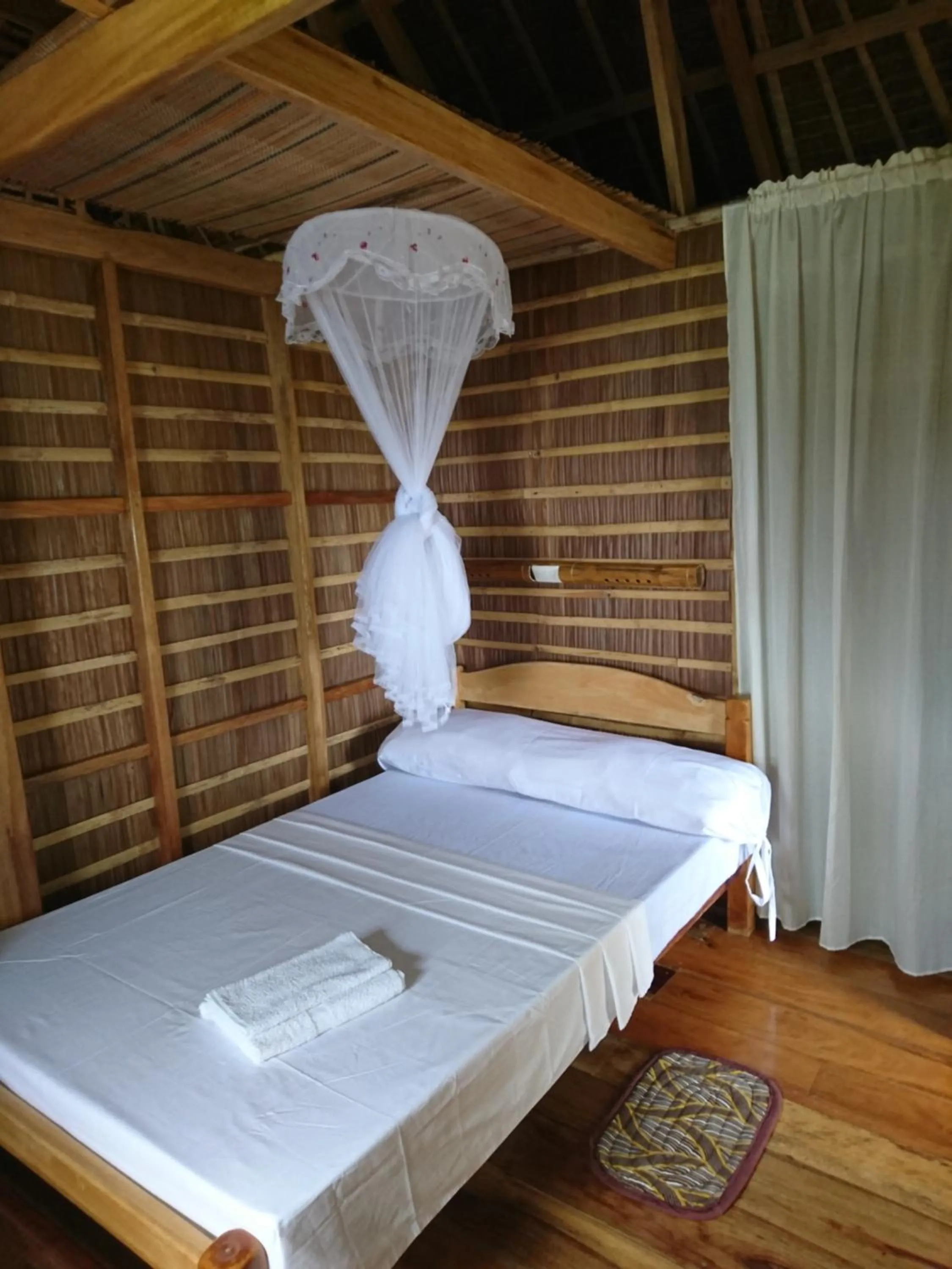 Bed in Tinaoog Beach Resort